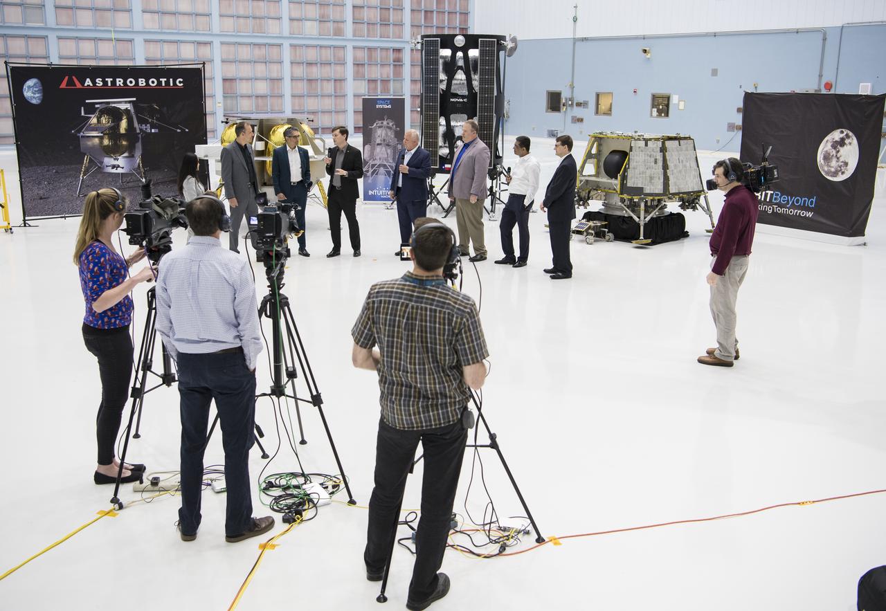 Astrobotic CEO, John Thornton, fourth from left, speaks about their lunar lander with, from left to right, NASA Press Officer, Felicia Chou; NASA Associate Administrator, Science Mission Directorate, Thomas Zurbuchen; Astrobotic Mission Director, Sharad Bhaskaran; Chairman of the Board of Intuitive Machines, Kam Ghaffarian; VP of Research and Development of Intuitive Machines, Tim Crain; President and CEO of OrbitBeyond, Siba Padhi; and Chief Science Officer, OrbitBeyond, Jon Morse, Friday, May 31, 2019, at Goddard Space Flight Center in Md. Astrobotic, Intuitive Machines, and OrbitBeyond have been selected to provide the first lunar landers for the Artemis program's lunar surface exploration. Photo credit: (NASA/Aubrey Gemignani)