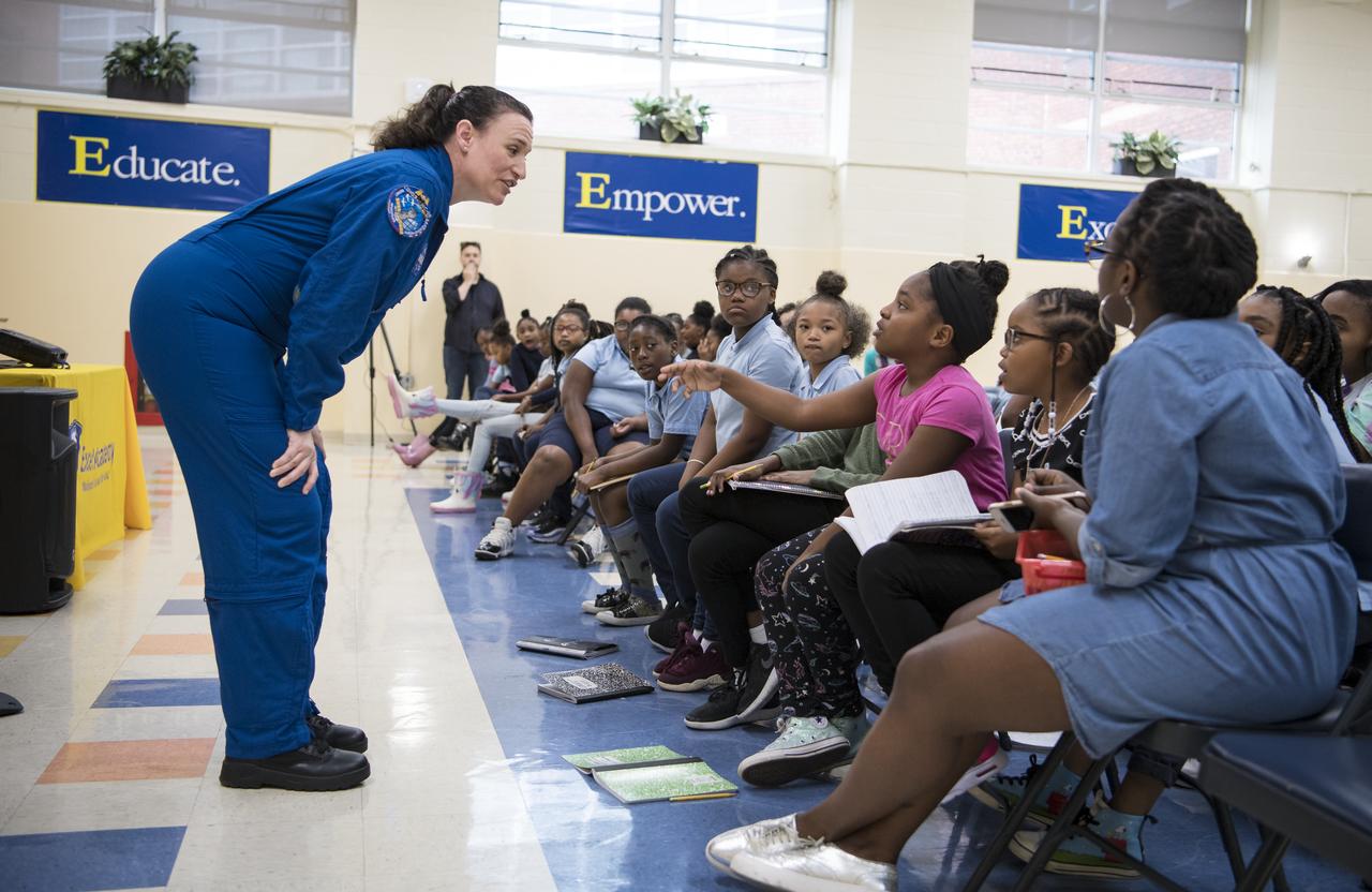 NASA astronaut Dr. Serena Auñón-Chancellor listens as a student asks her a question about her experience on Expeditions 56 and 57 onboard the International Space Station (ISS) at Excel Academy Public Charter School, Monday, June 10, 2019 in Washington, DC. Auñón-Chancellor spent 197 days living and working onboard the ISS and contributed to hundreds of experiments in biology, biotechnology, physical science, and Earth science while there. She is also a doctor and started her career with NASA as a flight surgeon in 2006. Photo Credit: (NASA/Aubrey Gemignani)