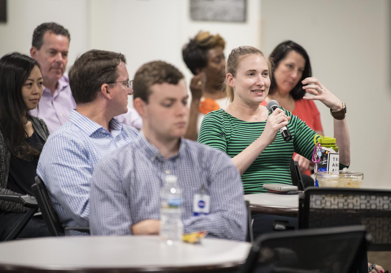 An audience member asks NASA astronaut Serena Auñón-Chancellor a question about her experience on Expeditions 56 and 57 onboard the International Space Station at NASA Headquarters, Friday, June 14, 2019 in Washington. Auñón-Chancellor spent 197 days living and working onboard the orbital laboratory, contributing to hundreds of experiments in biology, biotechnology, physical science, and Earth science. She began her career at NASA as a flight surgeon before being selected as an astronaut in 2009. Photo Credit: (NASA/Aubrey Gemignani)