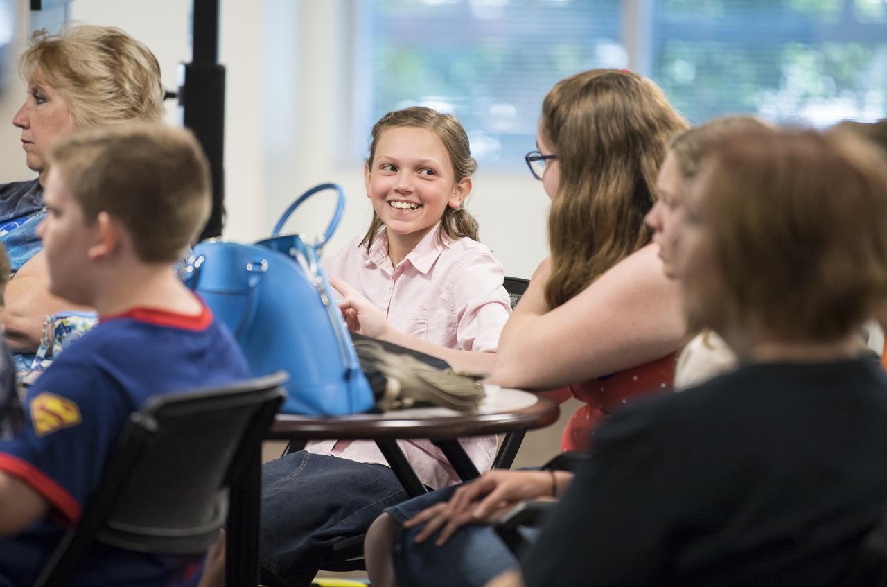 An audience member reacts as NASA astronaut Serena Auñón-Chancellor speaks about her experience on Expeditions 56 and 57 onboard the International Space Station at NASA Headquarters, Friday, June 14, 2019 in Washington. Auñón-Chancellor spent 197 days living and working onboard the orbital laboratory, contributing to hundreds of experiments in biology, biotechnology, physical science, and Earth science. She began her career at NASA as a flight surgeon before being selected as an astronaut in 2009. Photo Credit: (NASA/Aubrey Gemignani)