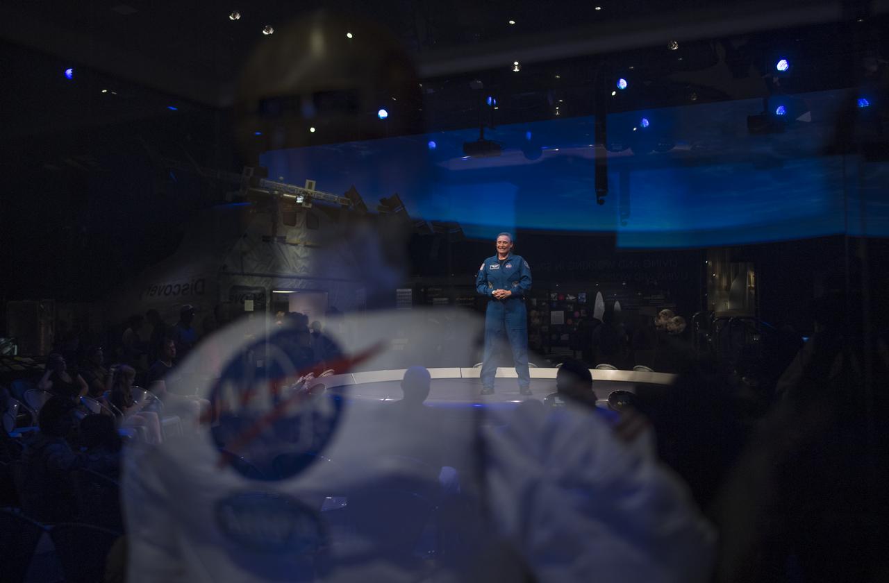 NASA astronaut Serena Auñón-Chancellor is seen reflected in a display case during an interview, Friday, June 14, 2019 the Smithsonian's National Air and Space Museum in Washington, DC. Auñón-Chancellor spent 197 days living and working onboard the orbital laboratory as part of Expeditions 56 and 57, contributing to hundreds of experiments in biology, biotechnology, physical science, and Earth science while there. She began her career at NASA as a flight surgeon before being selected as an astronaut in 2009. Photo Credit: (NASA/Joel Kowsky)