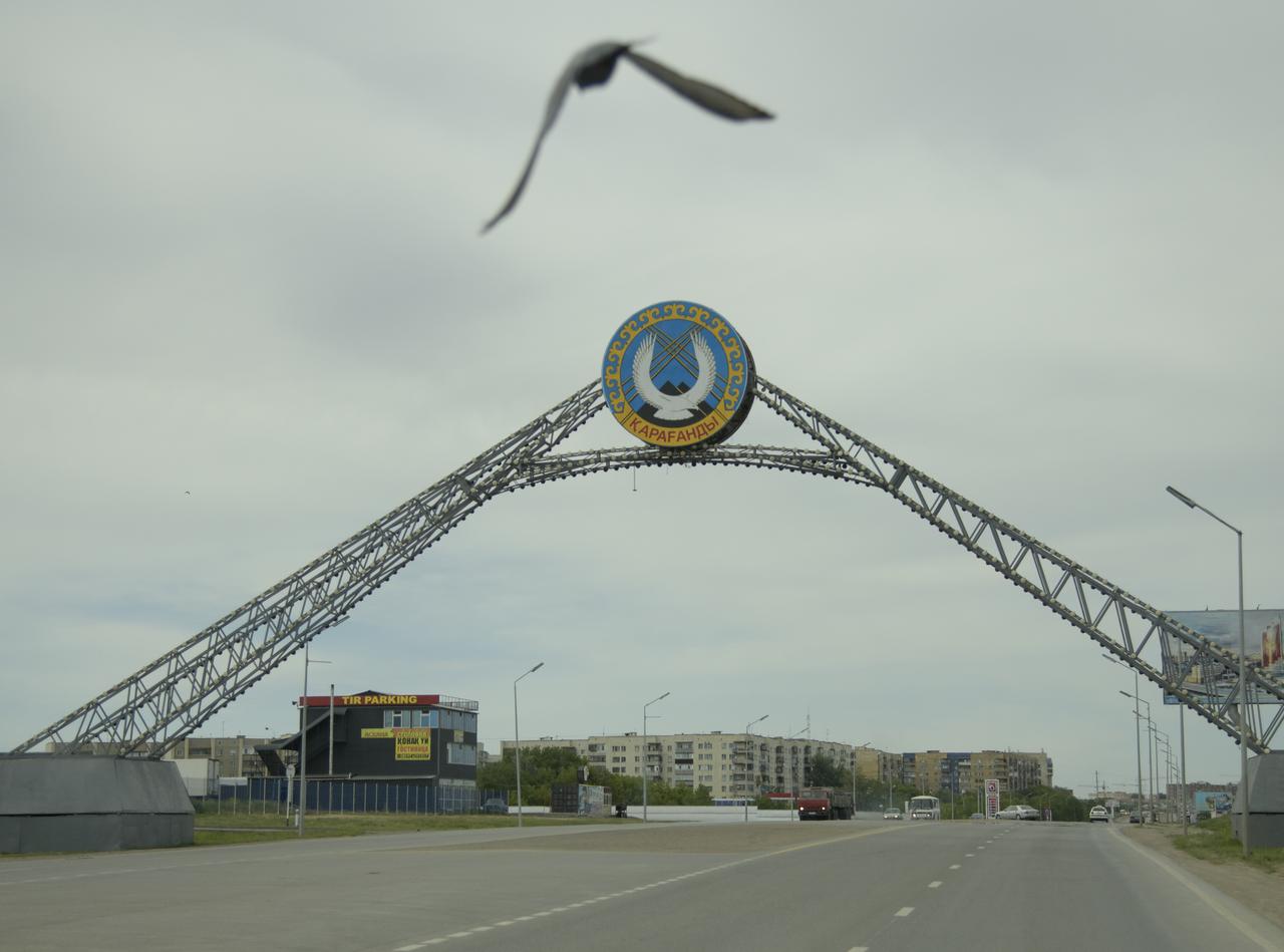 The Karaganda, Kazakhstan city entrance is seen as NASA, Canadian Space Agency (CSA), and Roscosmos teams arrive in preparation for the landing of Expedition 59 crew members Anne McClain of NASA, David Saint-Jacques of the Canadian Space Agency, and Oleg Kononenko of Roscosmos, Sunday, June 23, 2019. McClain, Saint-Jacques, and Kononenko are returning after 204 days in space where they served as members of the Expedition 58 and 59 crews onboard the International Space Station. Photo Credit: (NASA/Bill Ingalls)