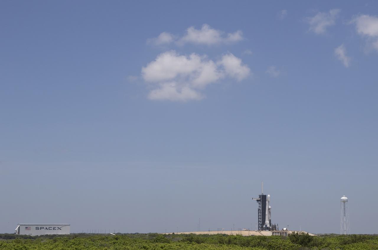 A SpaceX Falcon Heavy rocket carrying 24 satellites as part of the Department of Defense's Space Test Program-2 (STP-2) mission is seen at Launch Complex 39A, Monday, June 24, 2019 at NASA's Kennedy Space Center in Florida. Four NASA technology and science payloads which will study non-toxic spacecraft fuel, deep space navigation, "bubbles" in the electrically-charged layers of Earth's upper atmosphere, and radiation protection for satellites are among the two dozen satellites that will be launched. The three hour launch window opens at 11:30pm EDT on June 24. Photo Credit: (NASA/Joel Kowsky)