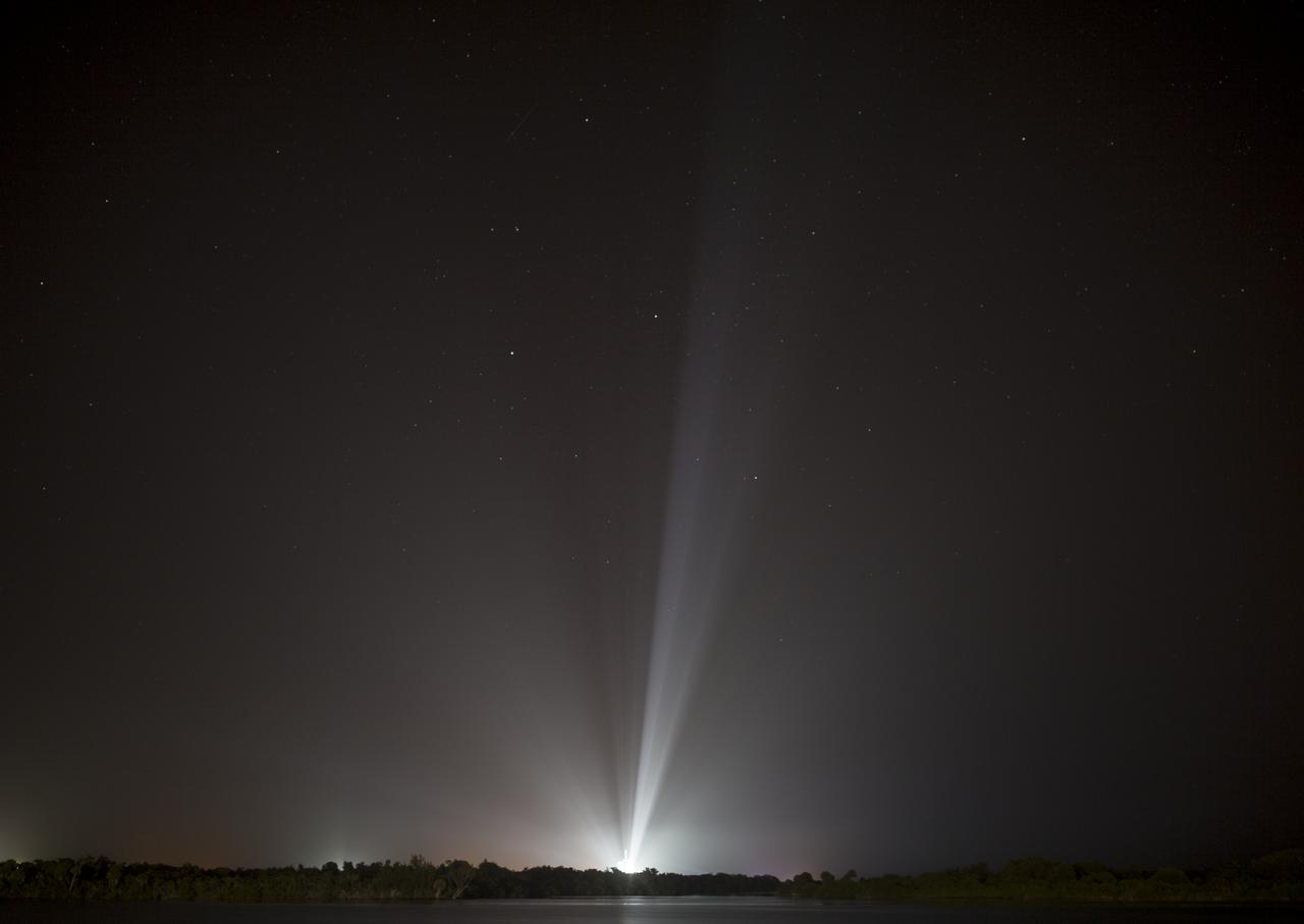 A SpaceX Falcon Heavy rocket carrying 24 satellites as part of the Department of Defense's Space Test Program-2 (STP-2) mission is seen illuminated by lights at Launch Complex 39A, Monday, June 24, 2019 at NASA's Kennedy Space Center in Florida. Four NASA technology and science payloads which will study non-toxic spacecraft fuel, deep space navigation, "bubbles" in the electrically-charged layers of Earth's upper atmosphere, and radiation protection for satellites are among the two dozen satellites that will be launched. The three hour launch window opens at 11:30pm EDT on June 24. Photo Credit: (NASA/Joel Kowsky)