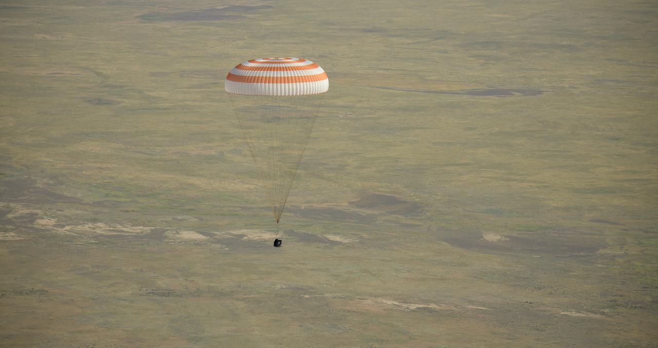 The Soyuz MS-11 spacecraft is seen as it lands in a remote area near the town of Zhezkazgan, Kazakhstan with Expedition 59 crew members Anne McClain of NASA, David Saint-Jacques of the Canadian Space Agency, and Oleg Kononenko of Roscosmos, Tuesday, June 25, 2019 Kazakh time (June 24 Eastern time). McClain, Saint-Jacques, and Kononenko are returning after 204 days in space where they served as members of the Expedition 58 and 59 crews onboard the International Space Station. Photo Credit: (NASA/Bill Ingalls)