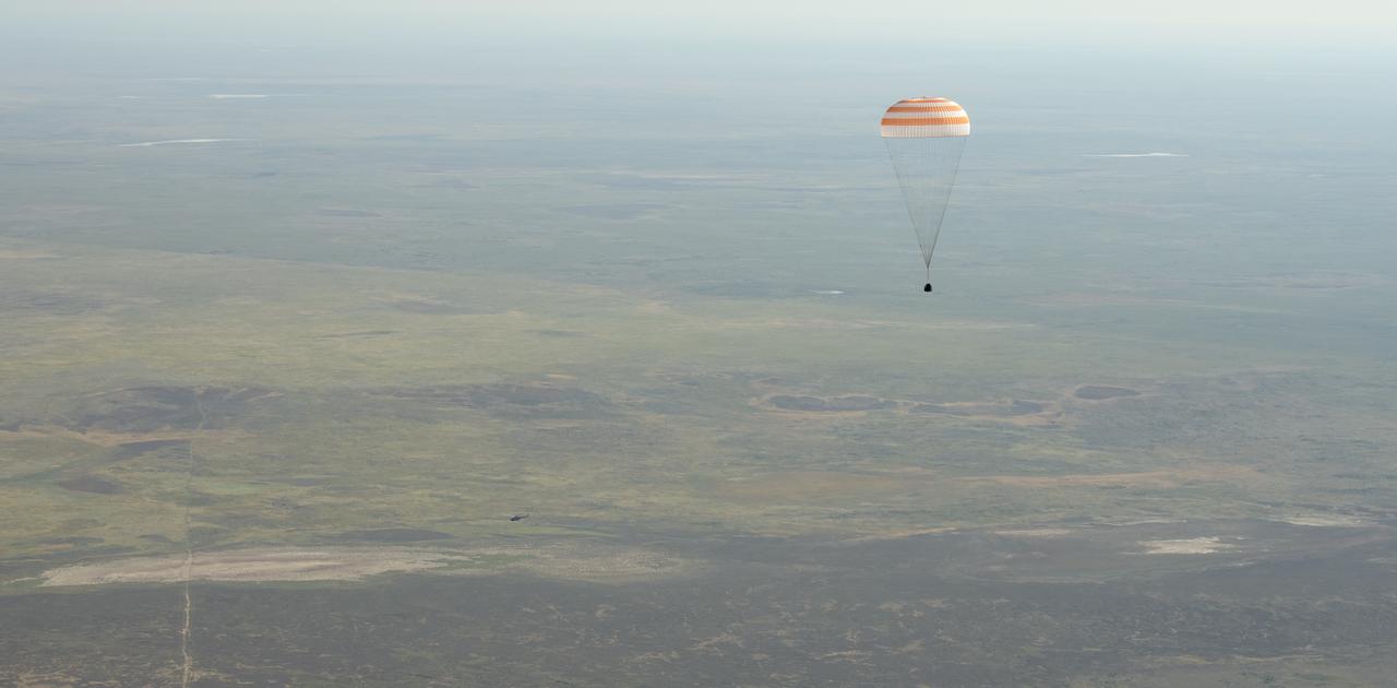 The Soyuz MS-11 spacecraft is seen as it lands in a remote area near the town of Zhezkazgan, Kazakhstan with Expedition 59 crew members Anne McClain of NASA, David Saint-Jacques of the Canadian Space Agency, and Oleg Kononenko of Roscosmos, Tuesday, June 25, 2019 Kazakh time (June 24 Eastern time). McClain, Saint-Jacques, and Kononenko are returning after 204 days in space where they served as members of the Expedition 58 and 59 crews onboard the International Space Station. Photo Credit: (NASA/Bill Ingalls)