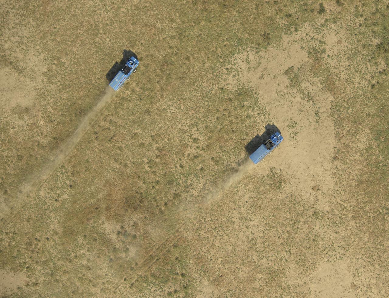 Russian Search and Rescue teams drive in all-terrain vehicles to the Soyuz MS-11 spacecraft shortly after it landed in a remote area near the town of Zhezkazgan, Kazakhstan with Expedition 59 crew members Anne McClain of NASA, David Saint-Jacques of the Canadian Space Agency, and Oleg Kononenko of Roscosmos, Tuesday, June 25, 2019 Kazakh time (June 24 Eastern time). McClain, Saint-Jacques, and Kononenko are returning after 204 days in space where they served as members of the Expedition 58 and 59 crews onboard the International Space Station. Photo Credit: (NASA/Bill Ingalls)