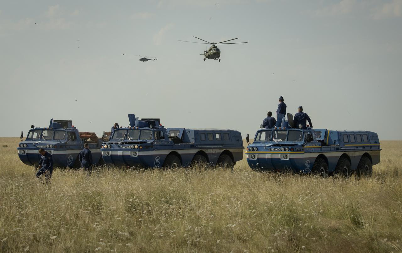 Russian Search and Rescue teams arrive at the Soyuz MS-11 spacecraft landing site after it landed in a remote area near the town of Zhezkazgan, Kazakhstan with Expedition 59 crew members Anne McClain of NASA, David Saint-Jacques of the Canadian Space Agency, and Oleg Kononenko of Roscosmos, Tuesday, June 25, 2019 Kazakh time (June 24 Eastern time). McClain, Saint-Jacques, and Kononenko are returning after 204 days in space where they served as members of the Expedition 58 and 59 crews onboard the International Space Station. Photo Credit: (NASA/Bill Ingalls)