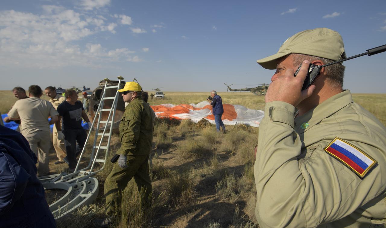 Russian Search and Rescue teams arrive at the Soyuz MS-11 spacecraft in a remote area near the town of Zhezkazgan, Kazakhstan shortly after it landed with Expedition 59 crew members Anne McClain of NASA, David Saint-Jacques of the Canadian Space Agency, and Oleg Kononenko of Roscosmos, Tuesday, June 25, 2019 Kazakh time (June 24 Eastern time). McClain, Saint-Jacques, and Kononenko are returning after 204 days in space where they served as members of the Expedition 58 and 59 crews onboard the International Space Station. Photo Credit: (NASA/Bill Ingalls)