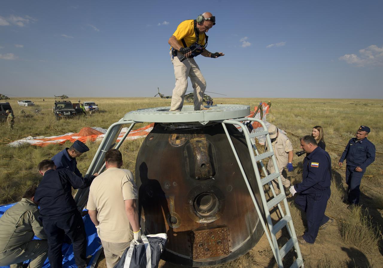 Russian Search and Rescue teams arrive at the Soyuz MS-11 spacecraft in a remote area near the town of Zhezkazgan, Kazakhstan shortly after it landed with Expedition 59 crew members Anne McClain of NASA, David Saint-Jacques of the Canadian Space Agency, and Oleg Kononenko of Roscosmos, Tuesday, June 25, 2019 Kazakh time (June 24 Eastern time). McClain, Saint-Jacques, and Kononenko are returning after 204 days in space where they served as members of the Expedition 58 and 59 crews onboard the International Space Station. Photo Credit: (NASA/Bill Ingalls)