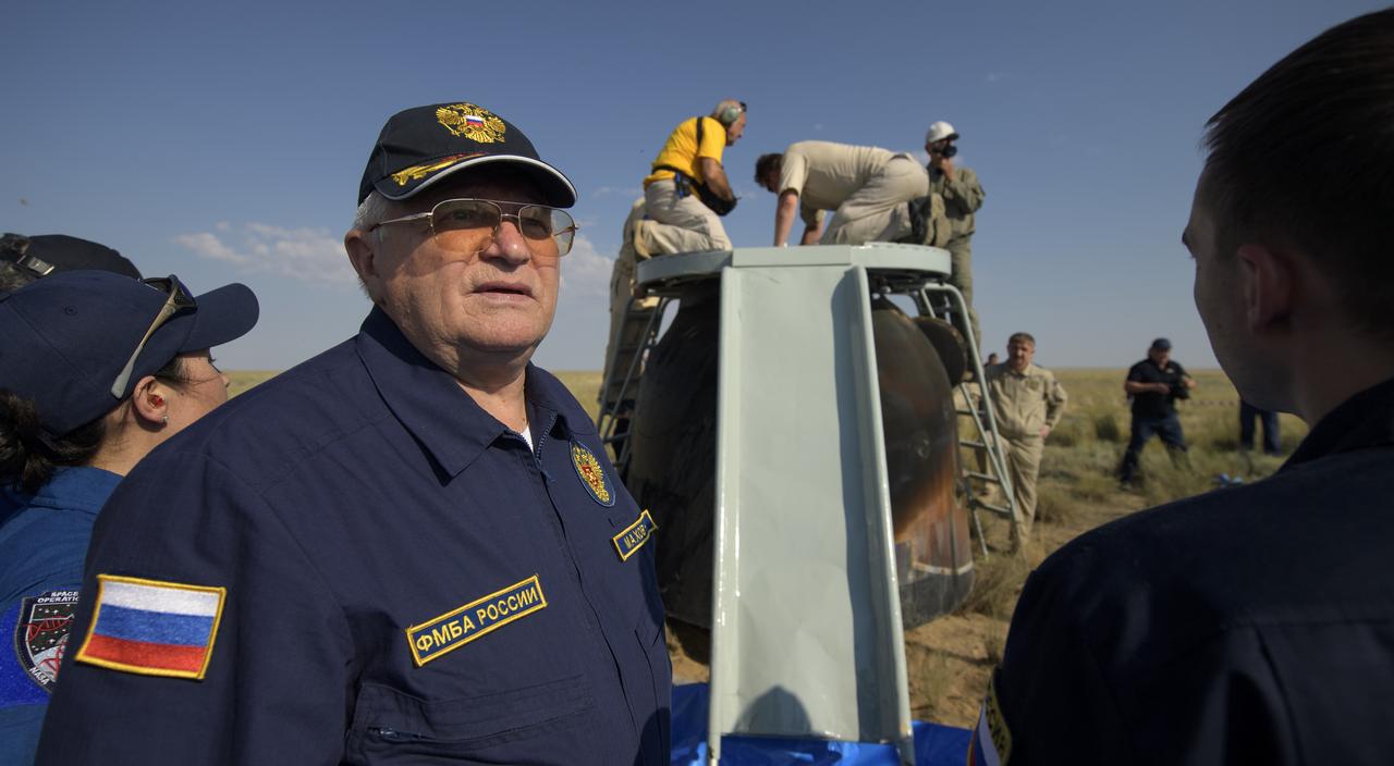 Russian Search and Rescue teams arrive at the Soyuz MS-11 spacecraft in a remote area near the town of Zhezkazgan, Kazakhstan shortly after it landed with Expedition 59 crew members Anne McClain of NASA, David Saint-Jacques of the Canadian Space Agency, and Oleg Kononenko of Roscosmos, Tuesday, June 25, 2019 Kazakh time (June 24 Eastern time). McClain, Saint-Jacques, and Kononenko are returning after 204 days in space where they served as members of the Expedition 58 and 59 crews onboard the International Space Station. Photo Credit: (NASA/Bill Ingalls)