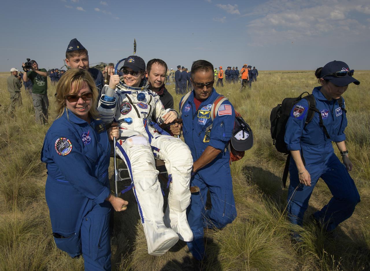 Expedition 59 astronaut Anne McClain of NASA is carried to a medical tent shortly after she, Canadian Space Agency astronaut David Saint-Jacques, and Roscosmos cosmonaut Oleg Kononenko landed in their Soyuz MS-11 spacecraft near the town of Zhezkazgan, Kazakhstan on Tuesday, June 25, 2019 Kazakh time (June 24 Eastern time). McClain, Saint-Jacques, and Kononenko are returning after 204 days in space where they served as members of the Expedition 58 and 59 crews onboard the International Space Station. Photo Credit: (NASA/Bill Ingalls)