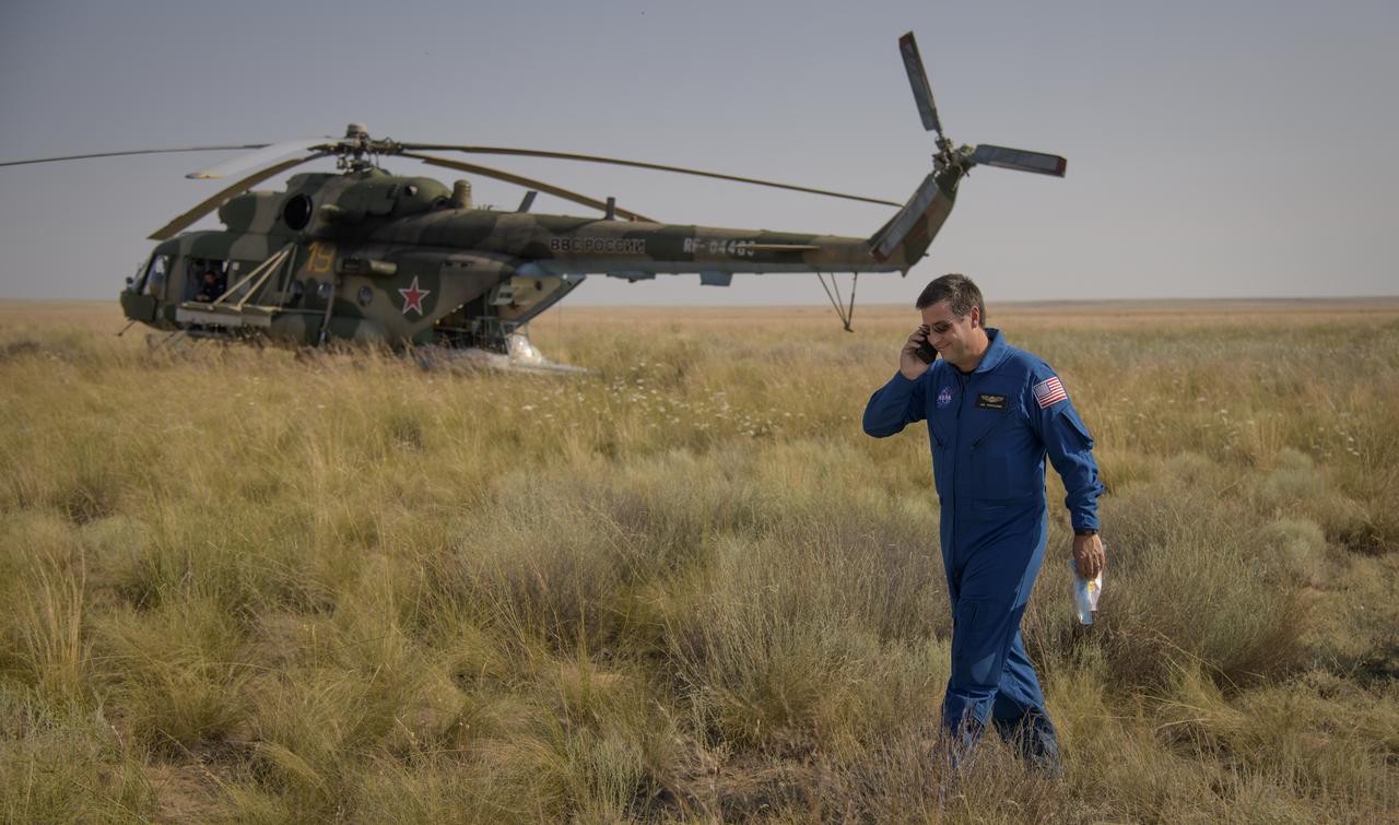 NASA ISS Deputy Program Manager Joel Montalbano talks to mission managers via satellite phone from the Soyuz MS-11 landing zone in a remote area near the town of Zhezkazgan, Kazakhstan on Tuesday, June 25, 2019 Kazakh time (June 24 Eastern time). Expedition 59 crew members Anne McClain of NASA, David Saint-Jacques of the Canadian Space Agency, and Oleg Kononenko of Roscosmos landed in their Soyuz MS-11 spacecraft after 204 days in space where they served as members of the Expedition 58 and 59 crews onboard the International Space Station. Photo Credit: (NASA/Bill Ingalls)