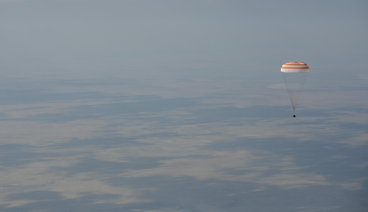 The Soyuz MS-11 spacecraft is seen as it lands in a remote area near the town of Zhezkazgan, Kazakhstan with Expedition 59 crew members Anne McClain of NASA, David Saint-Jacques of the Canadian Space Agency, and Oleg Kononenko of Roscosmos, Tuesday, June 25, 2019 Kazakh time (June 24 Eastern time). McClain, Saint-Jacques, and Kononenko are returning after 204 days in space where they served as members of the Expedition 58 and 59 crews onboard the International Space Station. Photo Credit: (NASA/Bill Ingalls)