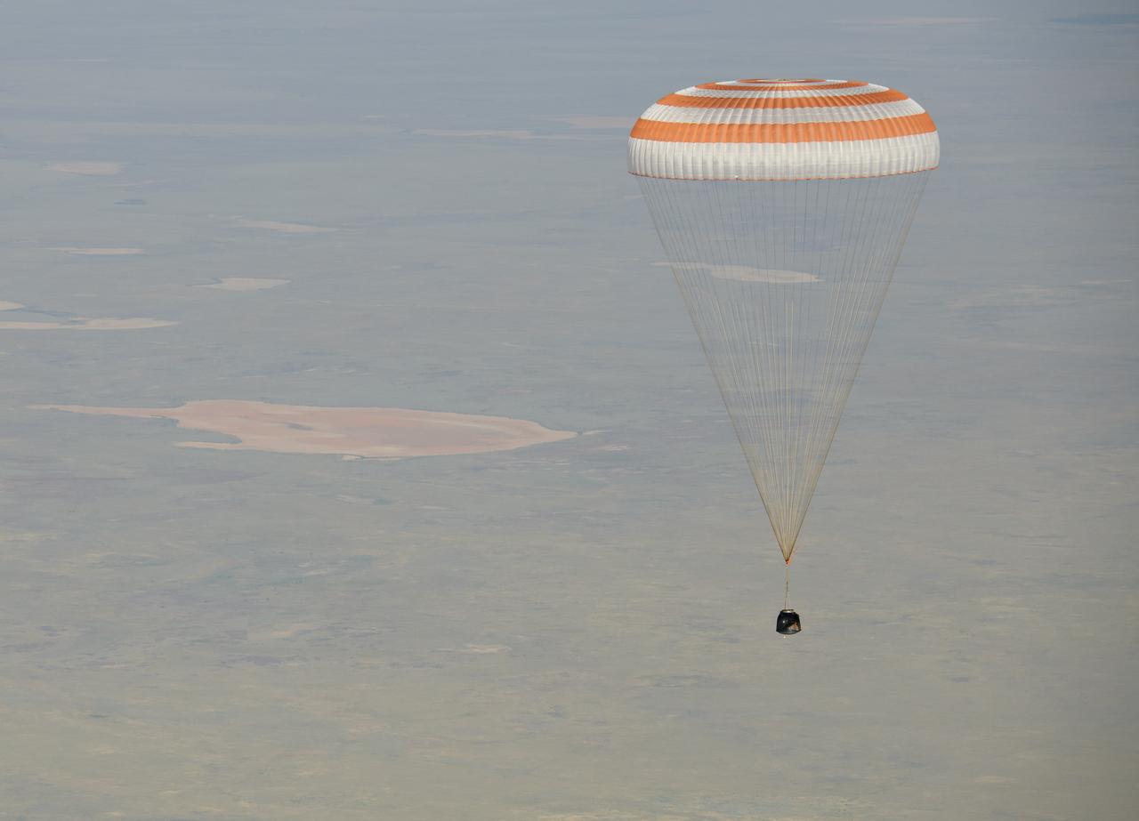 The Soyuz MS-11 spacecraft is seen as it lands in a remote area near the town of Zhezkazgan, Kazakhstan with Expedition 59 crew members Anne McClain of NASA, David Saint-Jacques of the Canadian Space Agency, and Oleg Kononenko of Roscosmos, Tuesday, June 25, 2019 Kazakh time (June 24 Eastern time). McClain, Saint-Jacques, and Kononenko are returning after 204 days in space where they served as members of the Expedition 58 and 59 crews onboard the International Space Station. Photo Credit: (NASA/Bill Ingalls)