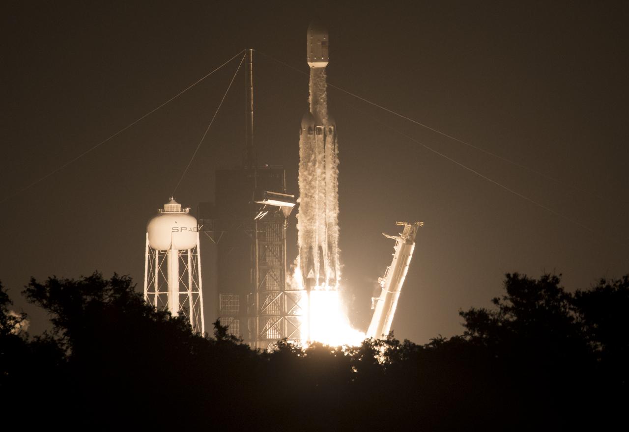 A SpaceX Falcon Heavy rocket carrying 24 satellites as part of the Department of Defense's Space Test Program-2 (STP-2) mission launches from Launch Complex 39A, Tuesday, June 25, 2019 at NASA's Kennedy Space Center in Florida. Four NASA technology and science payloads which will study non-toxic spacecraft fuel, deep space navigation, "bubbles" in the electrically-charged layers of Earth's upper atmosphere, and radiation protection for satellites are among the two dozen satellites that will be put into orbit. Photo Credit: (NASA/Joel Kowsky)