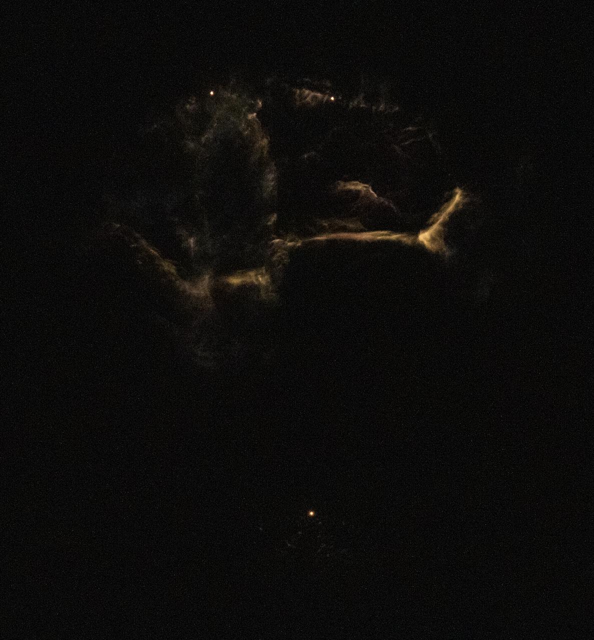 The two side boosters of the SpaceX Falcon Heavy rocket carrying 24 satellites as part of the Department of Defense's Space Test Program-2 (STP-2) mission are seen as they conduct a boost back burn to return to Landing Zone 1, Tuesday, June 25, 2019 at NASA's Kennedy Space Center in Florida. Four NASA technology and science payloads which will study non-toxic spacecraft fuel, deep space navigation, "bubbles" in the electrically-charged layers of Earth's upper atmosphere, and radiation protection for satellites are among the two dozen satellites that will be put into orbit. Photo Credit: (NASA/Joel Kowsky)