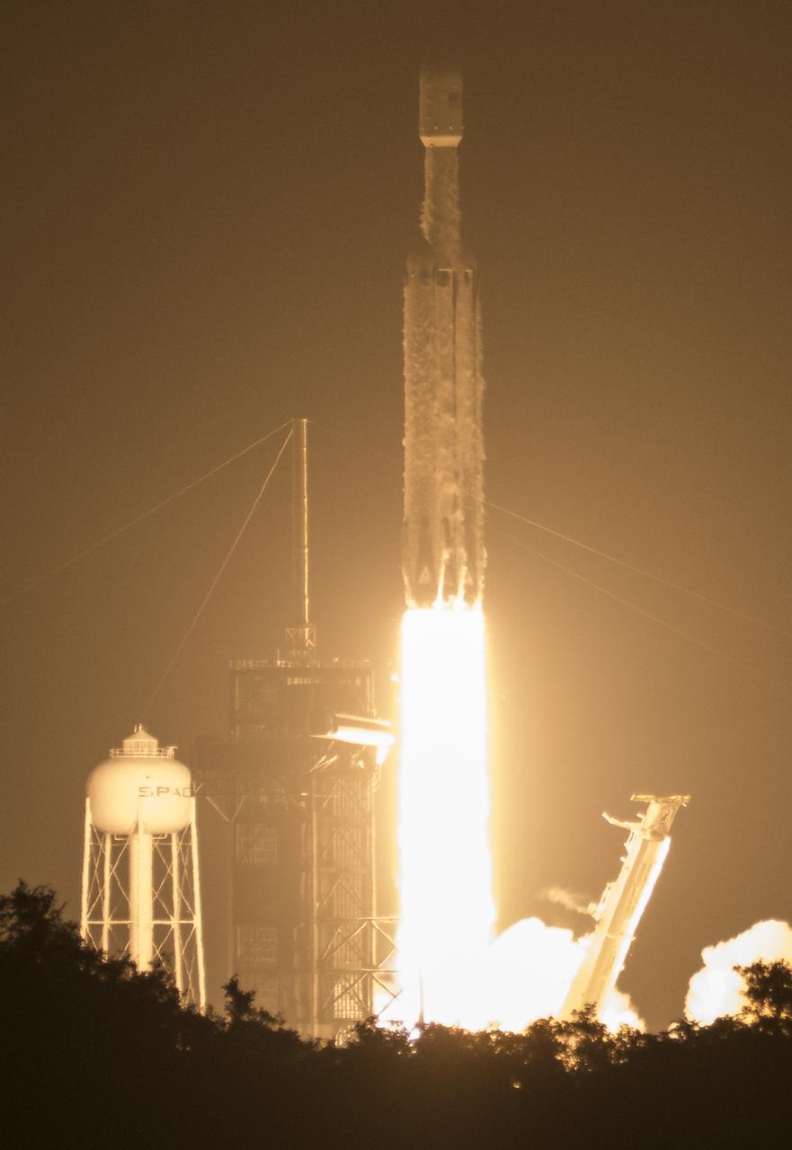 A SpaceX Falcon Heavy rocket carrying 24 satellites as part of the Department of Defense's Space Test Program-2 (STP-2) mission launches from Launch Complex 39A, Tuesday, June 25, 2019 at NASA's Kennedy Space Center in Florida. Four NASA technology and science payloads which will study non-toxic spacecraft fuel, deep space navigation, "bubbles" in the electrically-charged layers of Earth's upper atmosphere, and radiation protection for satellites are among the two dozen satellites that will be put into orbit. Photo Credit: (NASA/Joel Kowsky)
