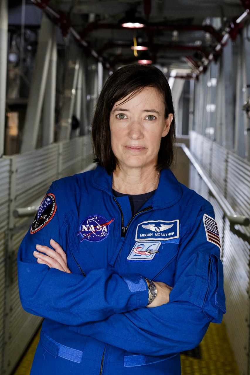 NASA astronaut Megan McArthur poses for a portrait on the Crew Access Arm of the mobile launcher, Tuesday, June 25, 2019 inside the Vehicle Assembly Building at NASA's Kennedy Space Center in Florida. Photo Credit: (NASA/Joel Kowsky)