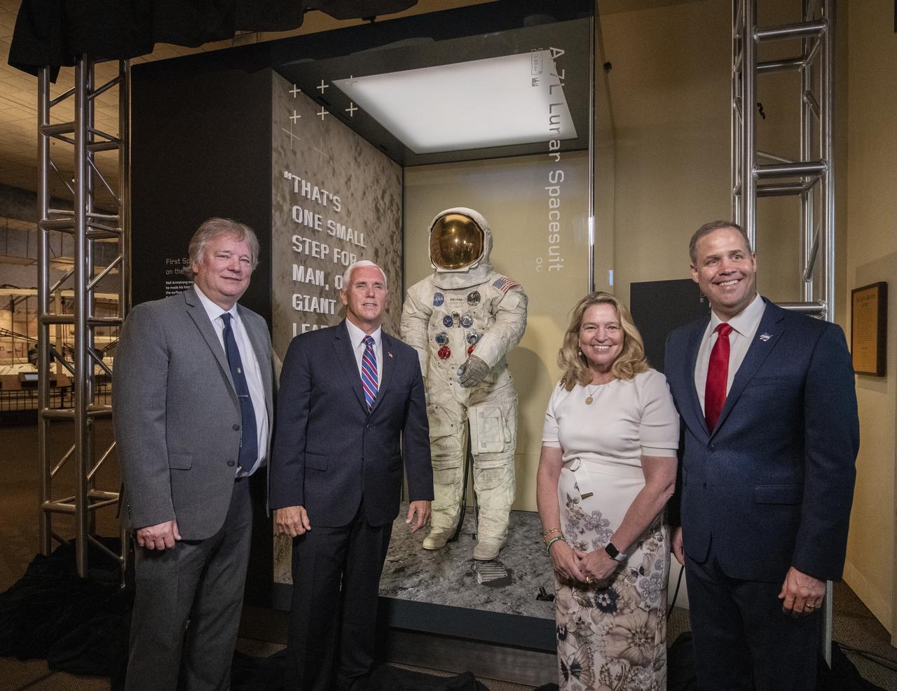In celebration of the 50th anniversary of Apollo 11, NASA Astronaut Neil Armstrong's spacesuit was unveiled today in The Wright Brothers and The Invention of the Aerial Age Gallery of the Smithsonian Air and Space Museum, in Washington, DC, July 16, 2019. Unveiling the spacesuit, from left, Rick Armstrong, son of Neil Armstrong, Vice President Mike Pence, Dr. Ellen Stofan, The John and Adrienne Mars Director of the National Air and Space Museum, and James Bridenstine, Administrator of NASA.  (Smithsonian Air and Space photo by Jim Preston)