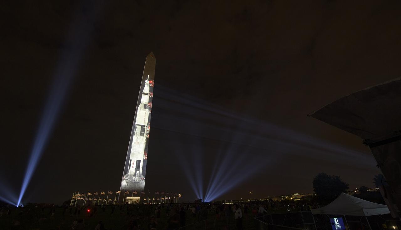 A full-sized, 363-foot Saturn V rocket is projected onto the east face of the Washington Monument 50 years to the day after astronauts Neil Armstrong, Michael Collins, and Buzz Aldrin launched on Apollo 11, the first mission to land astronauts on the Moon, Tuesday, July 16, 2019. On Friday, July 19, and Saturday, July 20, a special 17-minute show, “Apollo 50: Go for the Moon” will combine full-motion projection-mapping artwork on the monument and archival footage to recreate the launch of Apollo 11 and tell the story of the first moon landing. Photo Credit: (NASA/Bill Ingalls)