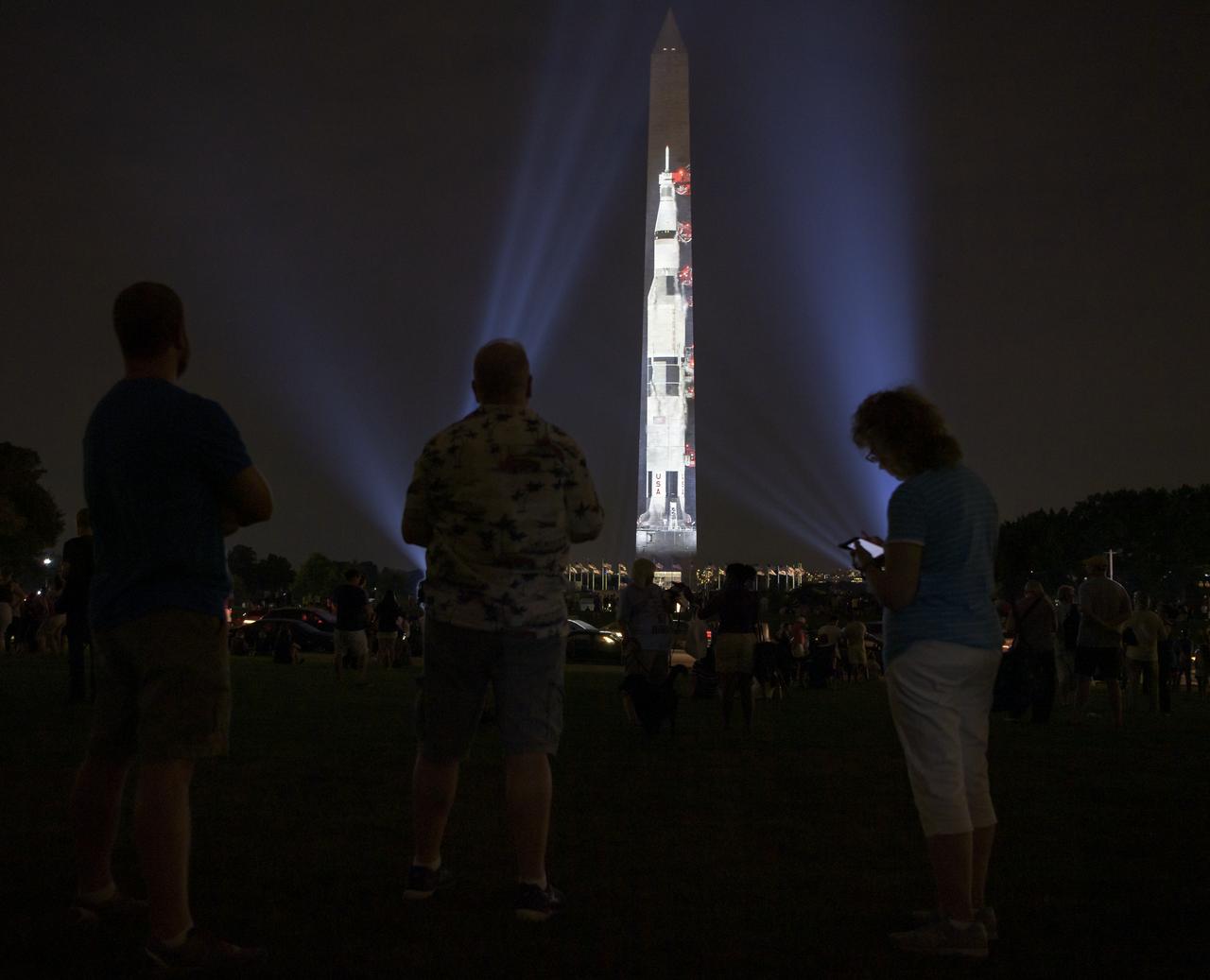 A full-sized, 363-foot Saturn V rocket is projected onto the east face of the Washington Monument 50 years to the day after astronauts Neil Armstrong, Michael Collins, and Buzz Aldrin launched on Apollo 11, the first mission to land astronauts on the Moon, Tuesday, July 16, 2019. On Friday, July 19, and Saturday, July 20, a special 17-minute show, “Apollo 50: Go for the Moon” will combine full-motion projection-mapping artwork on the monument and archival footage to recreate the launch of Apollo 11 and tell the story of the first moon landing. Photo Credit: (NASA/Bill Ingalls)
