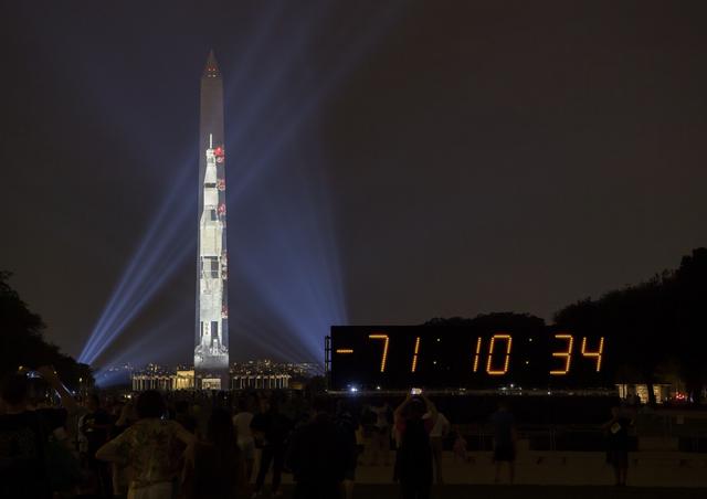 NASA image: Apollo 11 Saturn V Rocket Projected On The Washington Monument