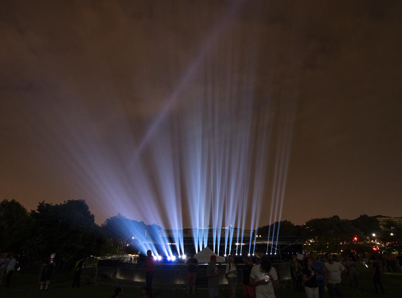 Projectors used to display a full-sized, 363-foot Saturn V rocket at the Washington Monument are seen 50 years to the day after astronauts Neil Armstrong, Michael Collins, and Buzz Aldrin launched on Apollo 11, the first mission to land astronauts on the Moon, Tuesday, July 16, 2019. On Friday, July 19, and Saturday, July 20, a special 17-minute show, “Apollo 50: Go for the Moon” will combine full-motion projection-mapping artwork on the monument and archival footage to recreate the launch of Apollo 11 and tell the story of the first moon landing. Photo Credit: (NASA/Bill Ingalls)