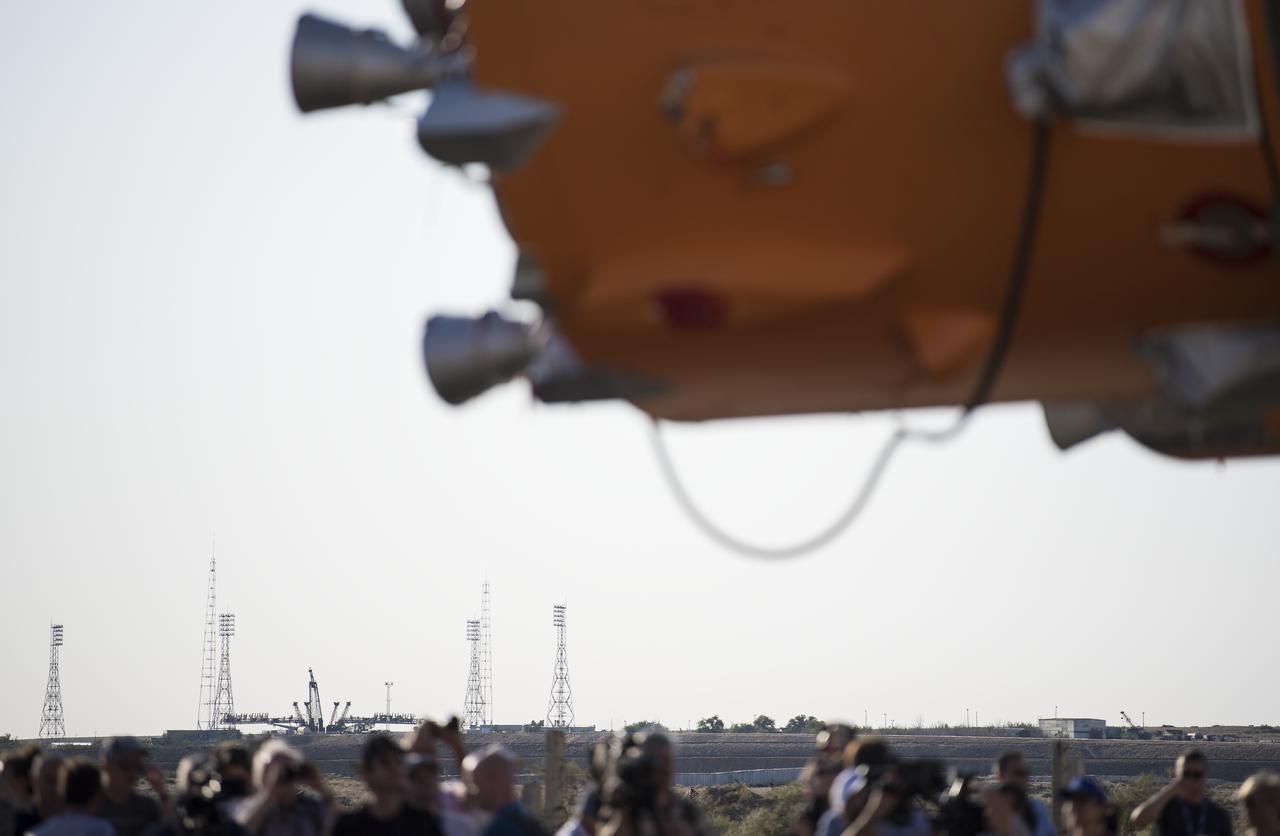 Launch Pad 1 at the Baikonur Cosmodrome is seen in the distance as the Soyuz rocket is rolled out by train, Thursday, July 18, 2019 at the Baikonur Cosmodrome in Kazakhstan. Expedition 60 Soyuz Commander Alexander Skvortsov of Roscosmos, flight engineer Andrew Morgan of NASA, and flight engineer Luca Parmitano of ESA (European Space Agency) are scheduled to launch aboard their Soyuz MS-13 spacecraft at 12:28 p.m. Eastern time (9:28 p.m. Baikonur time) , on Saturday, July 20. Photo Credit: (NASA/Joel Kowsky)