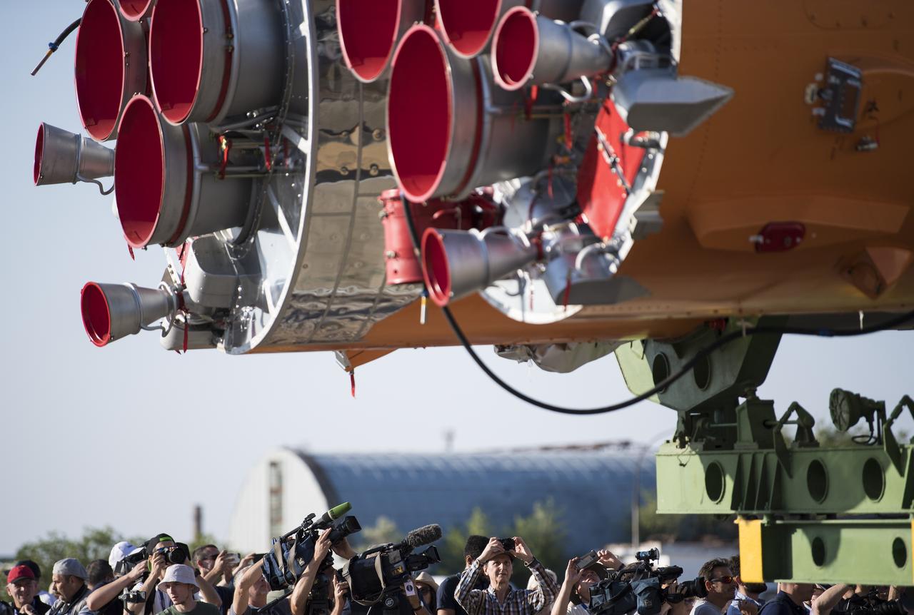 Members of the media and guests photograph the Soyuz rocket as it is rolled out of Building 112, Thursday, July 18, 2019 at the Baikonur Cosmodrome in Kazakhstan. Expedition 60 Soyuz Commander Alexander Skvortsov of Roscosmos, flight engineer Andrew Morgan of NASA, and flight engineer Luca Parmitano of ESA (European Space Agency) are scheduled to launch aboard their Soyuz MS-13 spacecraft at 12:28 p.m. Eastern time (9:28 p.m. Baikonur time) , on Saturday, July 20. Photo Credit: (NASA/Joel Kowsky)