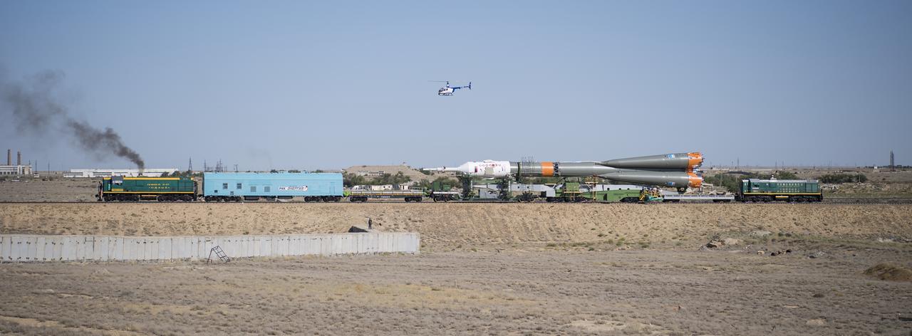 The Soyuz rocket is seen as it is transported to the launch pad by train, Thursday, July 18, 2019 at the Baikonur Cosmodrome in Kazakhstan. Expedition 60 Soyuz Commander Alexander Skvortsov of Roscosmos, flight engineer Andrew Morgan of NASA, and flight engineer Luca Parmitano of ESA (European Space Agency) are scheduled to launch aboard their Soyuz MS-13 spacecraft at 12:28 p.m. Eastern time (9:28 p.m. Baikonur time) , on Saturday, July 20. Photo Credit: (NASA/Joel Kowsky)