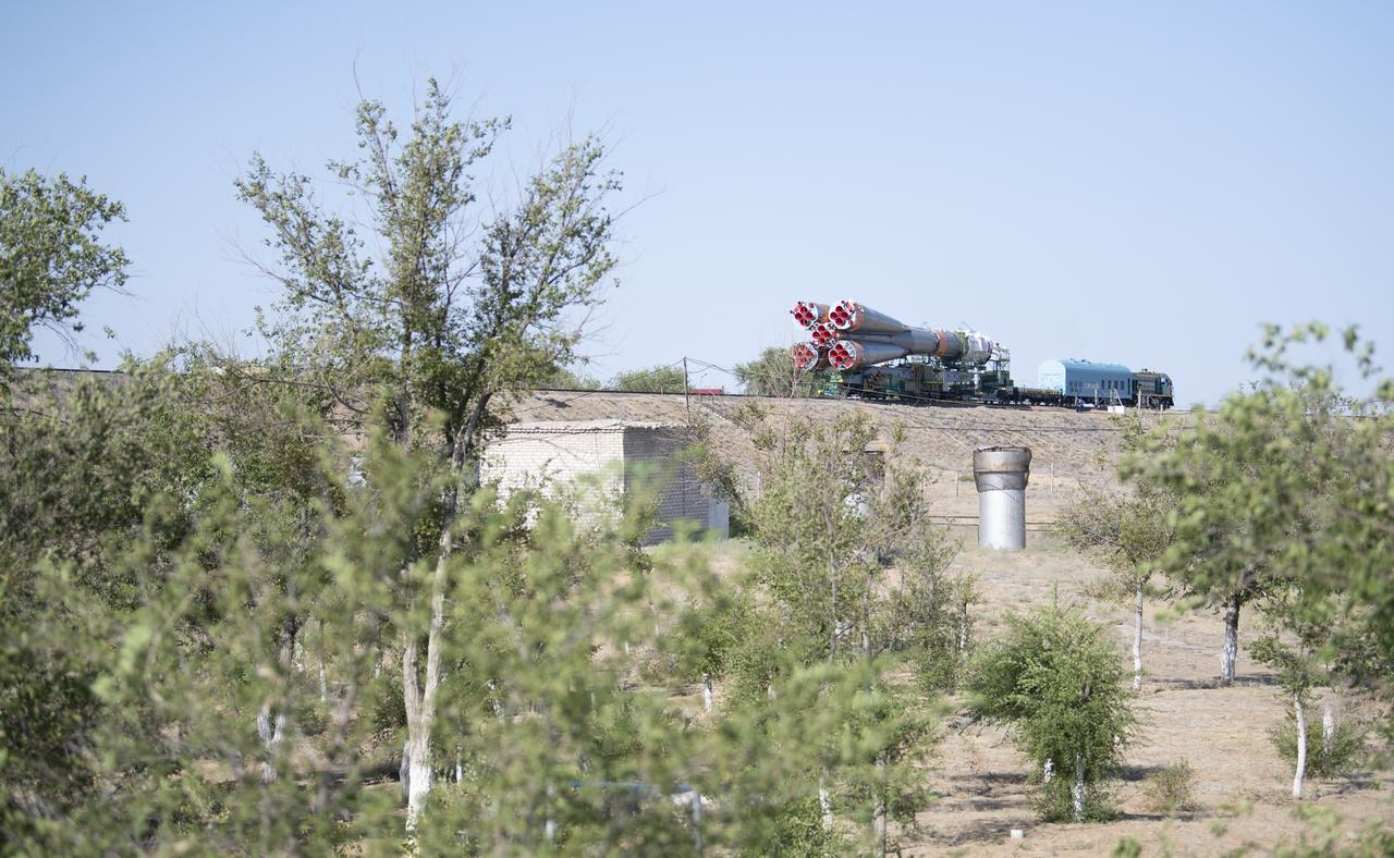 The Soyuz rocket is seen as it approaches the launch pad by train, Thursday, July 18, 2019 at the Baikonur Cosmodrome in Kazakhstan. Expedition 60 Soyuz Commander Alexander Skvortsov of Roscosmos, flight engineer Andrew Morgan of NASA, and flight engineer Luca Parmitano of ESA (European Space Agency) are scheduled to launch aboard their Soyuz MS-13 spacecraft at 12:28 p.m. Eastern time (9:28 p.m. Baikonur time) , on Saturday, July 20. Photo Credit: (NASA/Joel Kowsky)