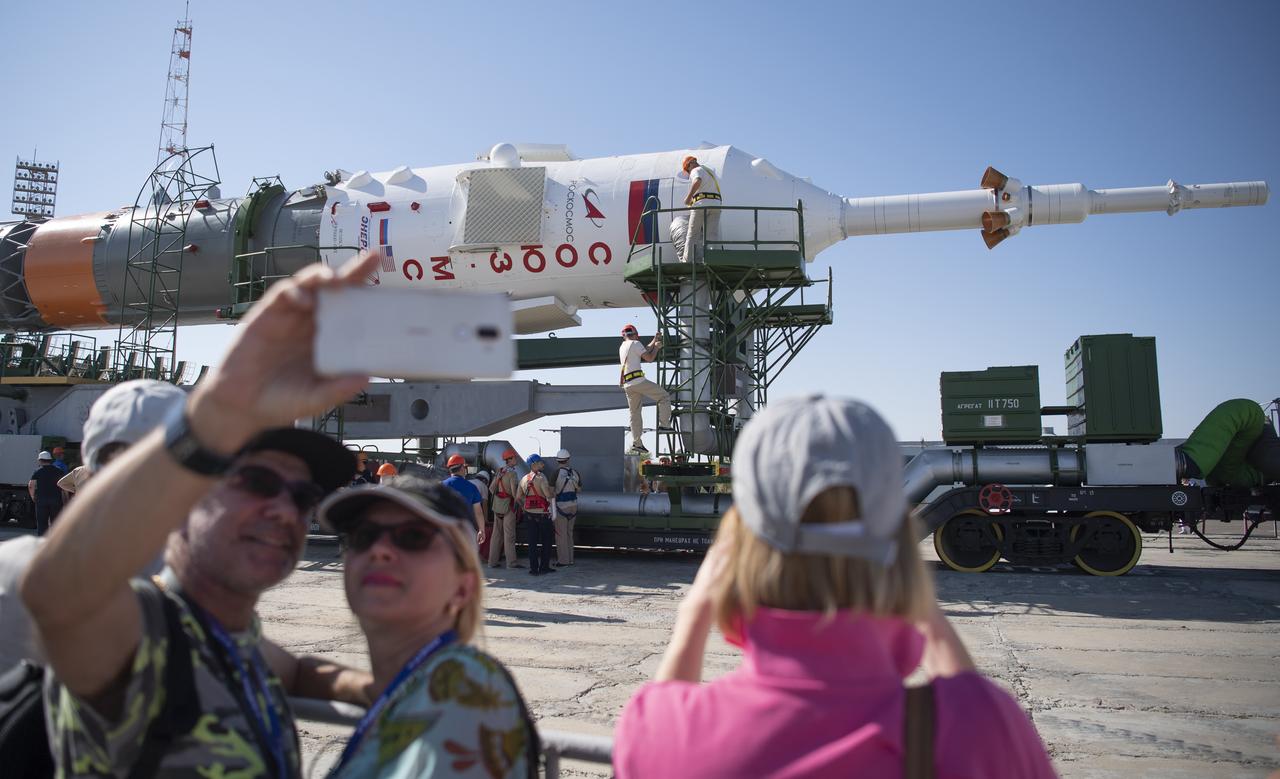 Workers are seen as they prepare the Soyuz rocket to be raised into a vertical position at the launch pad, Thursday, July 18, 2019 at the Baikonur Cosmodrome in Kazakhstan. Expedition 60 Soyuz Commander Alexander Skvortsov of Roscosmos, flight engineer Andrew Morgan of NASA, and flight engineer Luca Parmitano of ESA (European Space Agency) are scheduled to launch aboard their Soyuz MS-13 spacecraft at 12:28 p.m. Eastern time (9:28 p.m. Baikonur time) , on Saturday, July 20. Photo Credit: (NASA/Joel Kowsky)