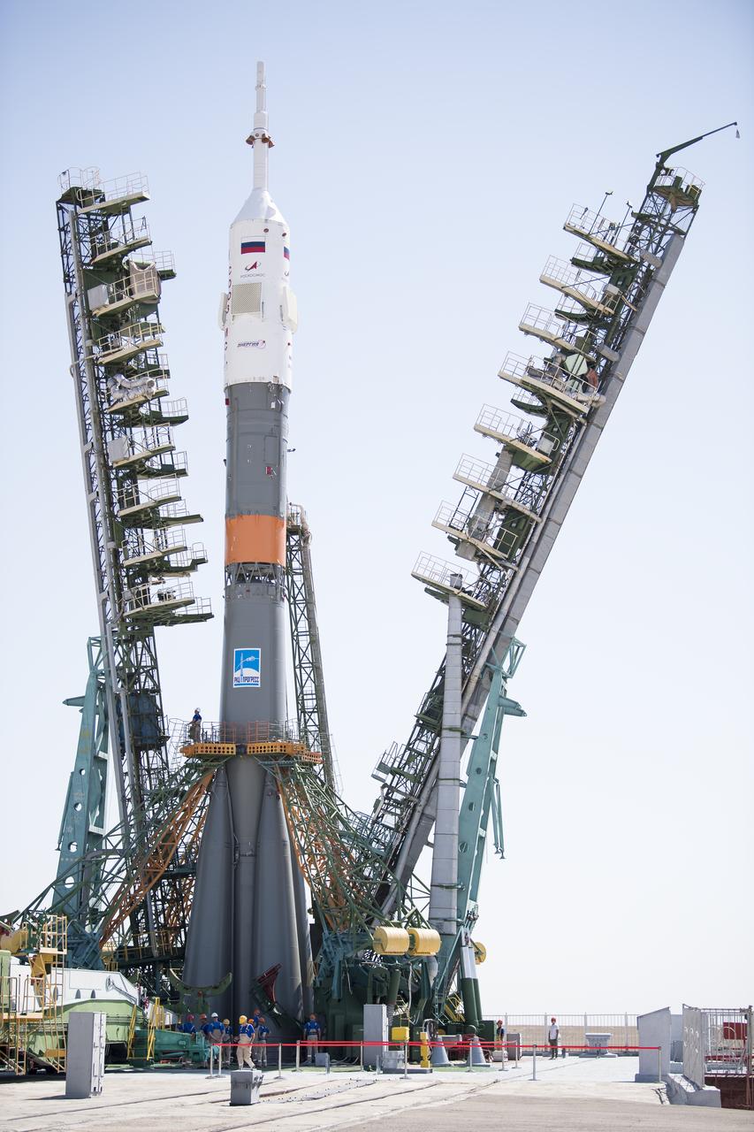 The Soyuz rocket is see on the launch pad as the service structure arms are closed around it, Thursday, July 18, 2019 at the Baikonur Cosmodrome in Kazakhstan. Expedition 60 Soyuz Commander Alexander Skvortsov of Roscosmos, flight engineer Andrew Morgan of NASA, and flight engineer Luca Parmitano of ESA (European Space Agency) are scheduled to launch aboard their Soyuz MS-13 spacecraft at 12:28 p.m. Eastern time (9:28 p.m. Baikonur time) , on Saturday, July 20. Photo Credit: (NASA/Joel Kowsky)