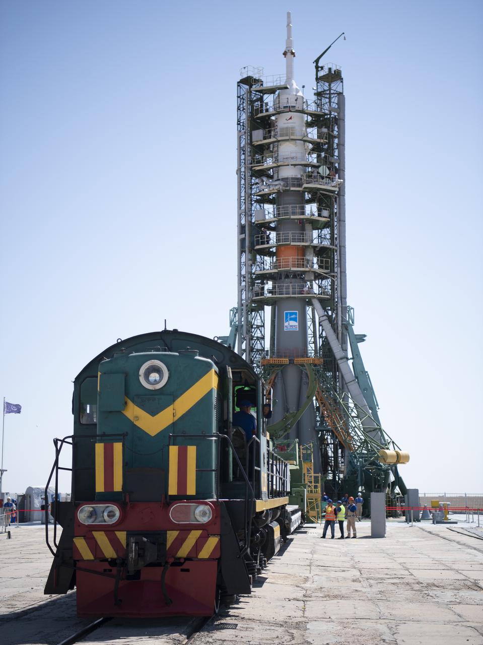 The Soyuz rocket is see on the launch pad after the service structure arms were closed around it, Thursday, July 18, 2019 at the Baikonur Cosmodrome in Kazakhstan. Expedition 60 Soyuz Commander Alexander Skvortsov of Roscosmos, flight engineer Andrew Morgan of NASA, and flight engineer Luca Parmitano of ESA (European Space Agency) are scheduled to launch aboard their Soyuz MS-13 spacecraft at 12:28 p.m. Eastern time (9:28 p.m. Baikonur time) , on Saturday, July 20. Photo Credit: (NASA/Joel Kowsky)