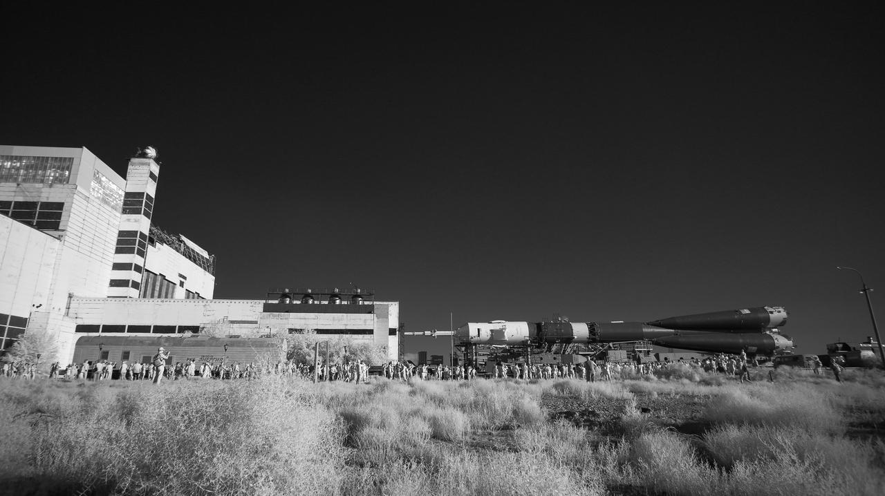 In this black and white infrared image, the Soyuz rocket is seen as it transported to the launch pad by train, Thursday, July 18, 2019 at the Baikonur Cosmodrome in Kazakhstan. Expedition 60 Soyuz Commander Alexander Skvortsov of Roscosmos, flight engineer Andrew Morgan of NASA, and flight engineer Luca Parmitano of ESA (European Space Agency) are scheduled to launch aboard their Soyuz MS-13 spacecraft at 12:28 p.m. Eastern time (9:28 p.m. Baikonur time), on Saturday, July 20. Photo Credit: (NASA/Joel Kowsky)