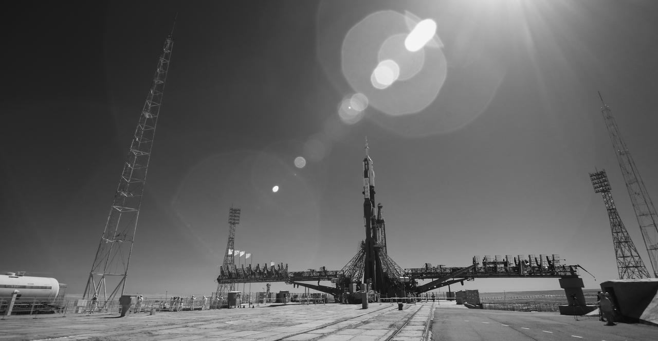 In this black and white infrared image, the Soyuz rocket is seen on the launch pad after being raised into a vertical position, Thursday, July 18, 2019 at the Baikonur Cosmodrome in Kazakhstan. Expedition 60 Soyuz Commander Alexander Skvortsov of Roscosmos, flight engineer Andrew Morgan of NASA, and flight engineer Luca Parmitano of ESA (European Space Agency) are scheduled to launch aboard their Soyuz MS-13 spacecraft at 12:28 p.m. Eastern time (9:28 p.m. Baikonur time), on Saturday, July 20.  Photo Credit: (NASA/Joel Kowsky)