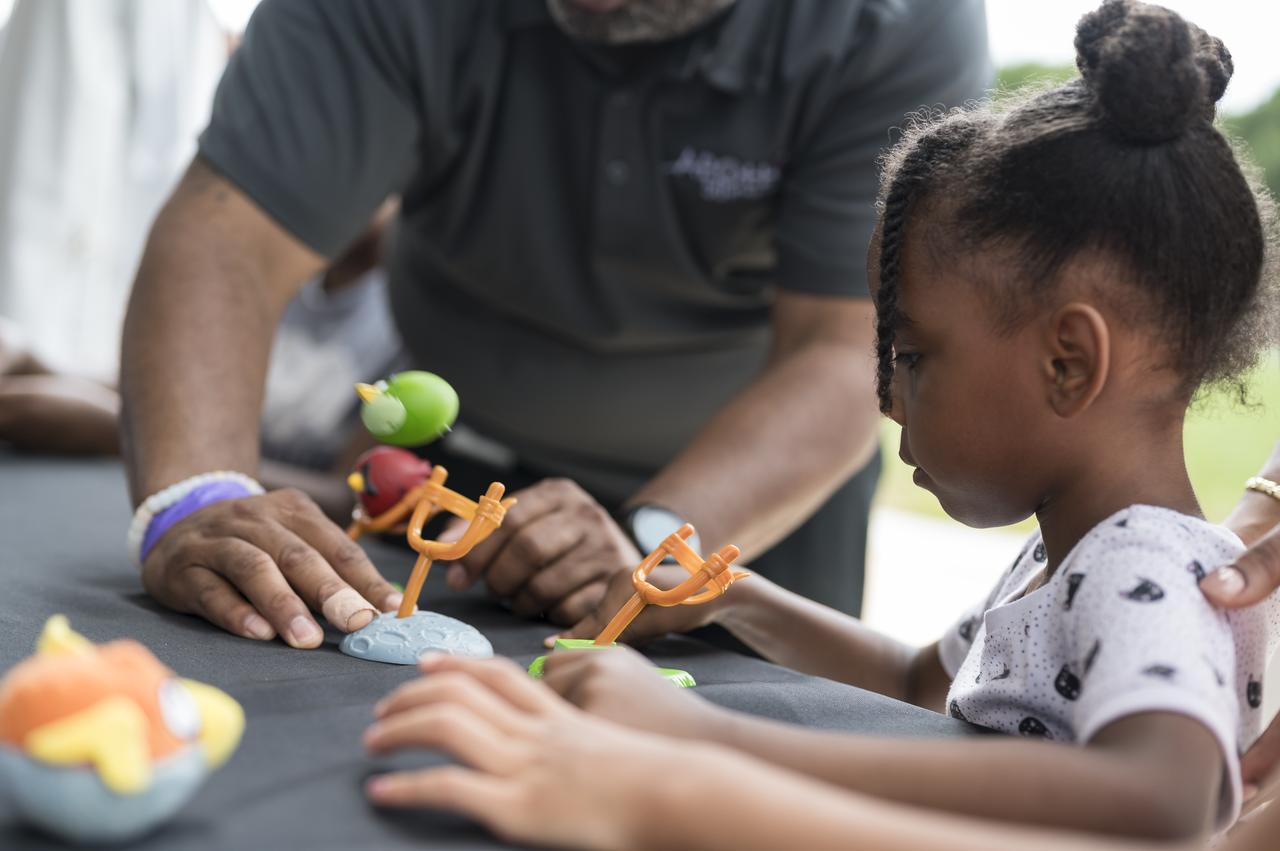 A visitor catapults an Angry Bird at a NASA exhibit at the Apollo 11 50th Anniversary celebration on the National Mall, Thursday, July 18, 2019 in Washington. Apollo 11 was the first mission to land astronauts on the Moon and launched on July 16, 1969 with astronauts Neil Armstrong, Michael Collins, and Buzz Aldrin. Photo Credit: (NASA/Aubrey Gemignani)