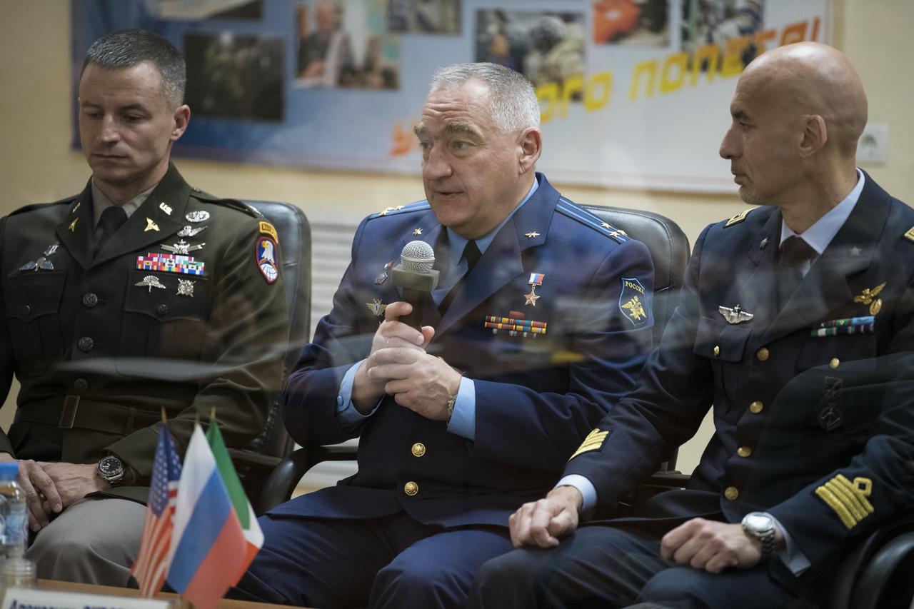 Expedition 60 Soyuz Commander Alexander Skvortsov of Roscosmos, center, speaks during the State Commission meeting to approve the Soyuz launch of Expedition 60 to the International Space Station, Friday, July 19, 2019 at the Cosmonaut Hotel in Baikonur, Kazakhstan. Skvortsov, Andrew Morgan of NASA, left, and Luca Parmitano of ESA (European Space Agency), right, are scheduled to launch to the International Space Station aboard the Soyuz MS-13 spacecraft on Saturday, July 20. Photo Credit: (NASA/Joel Kowsky)