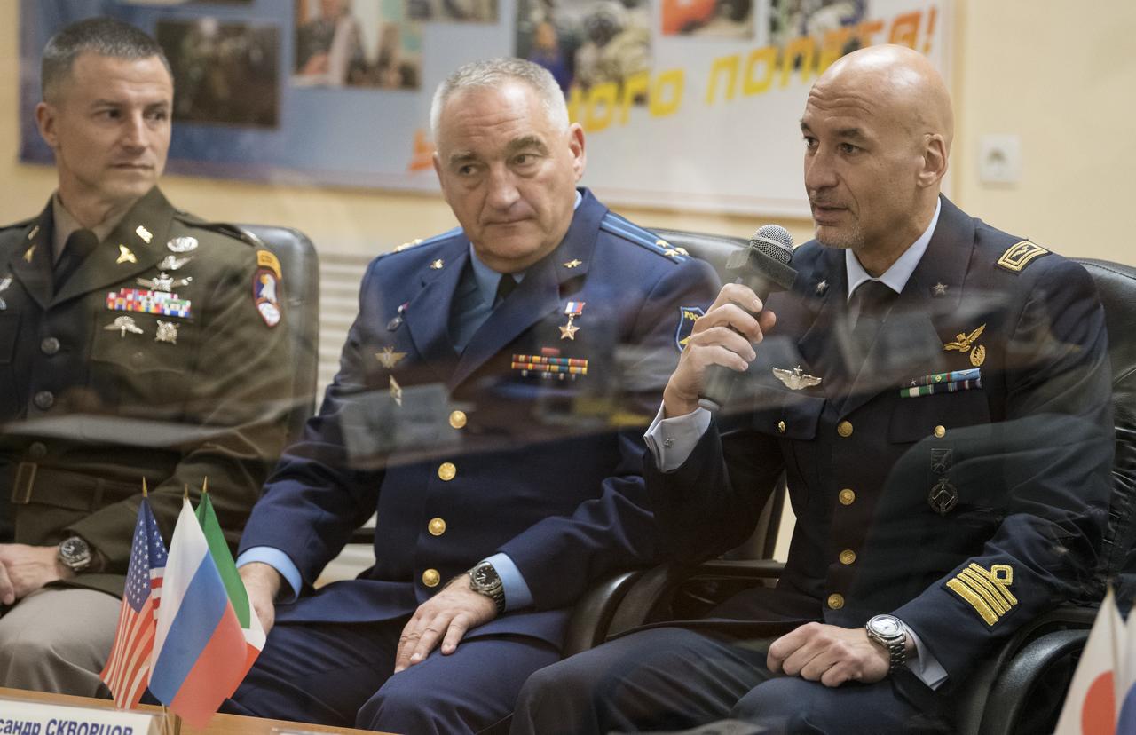 Expedition 60 flight engineer Luca Parmitano of ESA (European Space Agency), right, speaks during the State Commission meeting to approve the Soyuz launch of Expedition 60 to the International Space Station, Friday, July 19, 2019 at the Cosmonaut Hotel in Baikonur, Kazakhstan. Parmitano, Soyuz Commander Alexander Skvortsov of Roscosmos, center, and Andrew Morgan of NASA, left, are scheduled to launch to the International Space Station aboard the Soyuz MS-13 spacecraft on Saturday, July 20. Photo Credit: (NASA/Joel Kowsky)