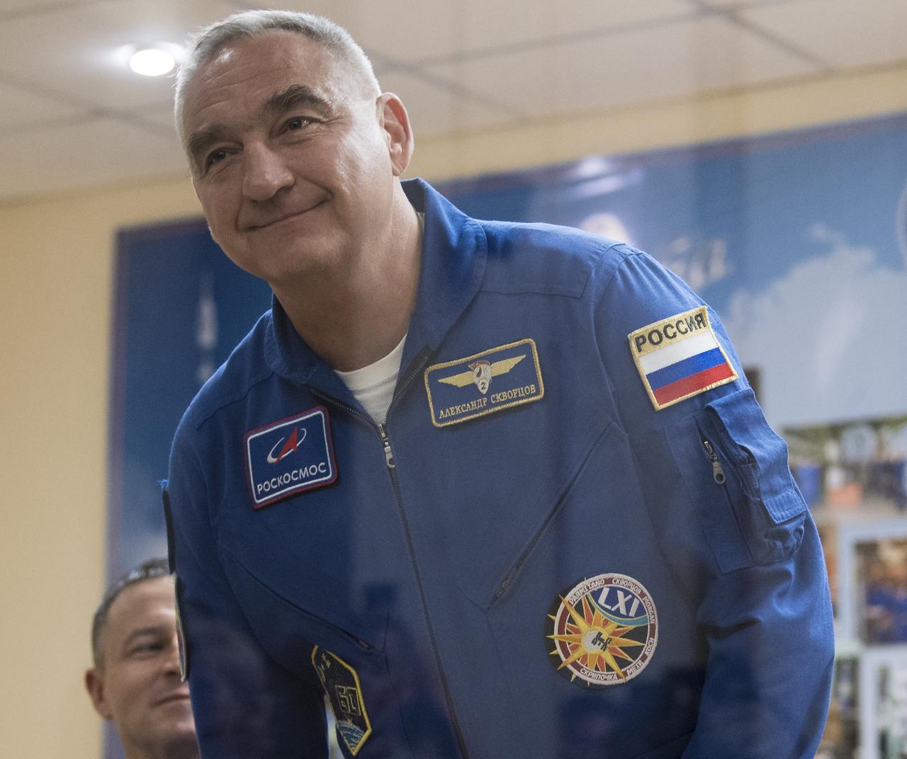 Expedition 60 Soyuz Commander Alexander Skvortsov of Roscosmos is introduced during a press conference, Friday, July 19, 2019 at the Cosmonaut Hotel in Baikonur, Kazakhstan. Expedition 60 Soyuz Commander Alexander Skvortsov of Roscosmos, flight engineer Andrew Morgan of NASA, and flight engineer Luca Parmitano of ESA (European Space Agency) are scheduled to launch to the International Space Station aboard the Soyuz MS-13 spacecraft at 12:28 p.m. Eastern time (9:28 p.m. Baikonur time) on Saturday, July 20. Photo Credit: (NASA/Joel Kowsky)