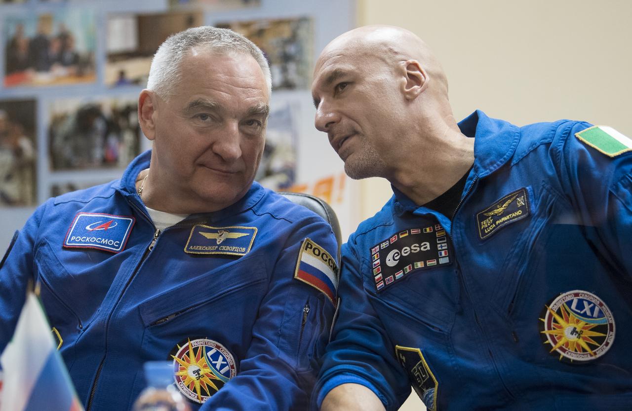 Expedition 60 Soyuz Commander Alexander Skvortsov of Roscosmos, left, and flight engineer Luca Parmitano of ESA (European Space Agency) are seen during a press conference, Friday, July 19, 2019 at the Cosmonaut Hotel in Baikonur, Kazakhstan. Skvortsov, Parmitano, and flight engineer Andrew Morgan of NASA, are scheduled to launch to the International Space Station aboard the Soyuz MS-13 spacecraft at 12:28 p.m. Eastern time (9:28 p.m. Baikonur time) on Saturday, July 20. Photo Credit: (NASA/Joel Kowsky)