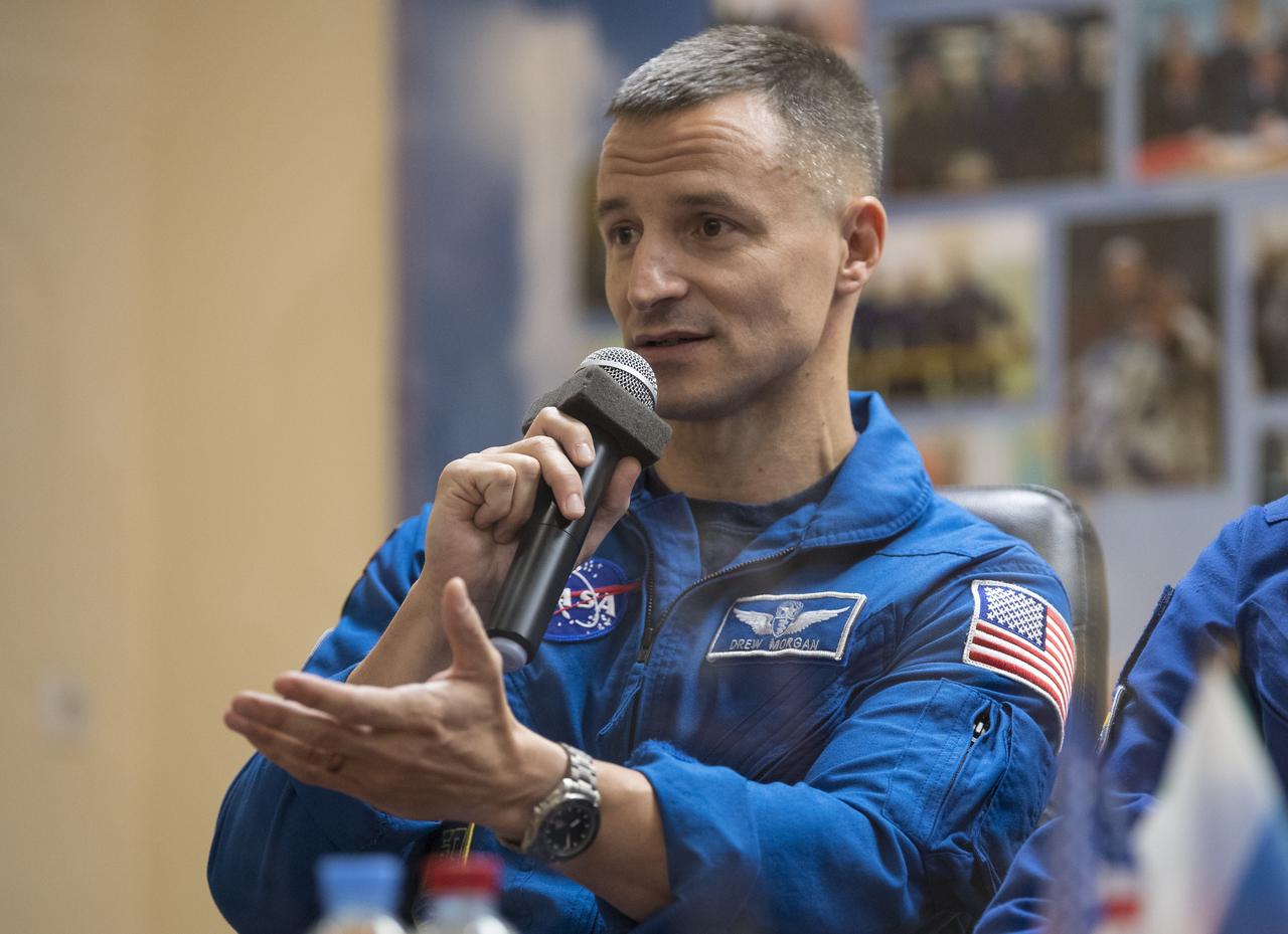 Expedition 60 flight engineer Andrew Morgan of NASA answers a question during a press conference, Friday, July 19, 2019 at the Cosmonaut Hotel in Baikonur, Kazakhstan. Morgan, Soyuz Commander Alexander Skvortsov of Roscosmos, and flight engineer Luca Parmitano of ESA (European Space Agency) are scheduled to launch to the International Space Station aboard the Soyuz MS-13 spacecraft at 12:28 p.m. Eastern time (9:28 p.m. Baikonur time) on Saturday, July 20. Photo Credit: (NASA/Joel Kowsky)