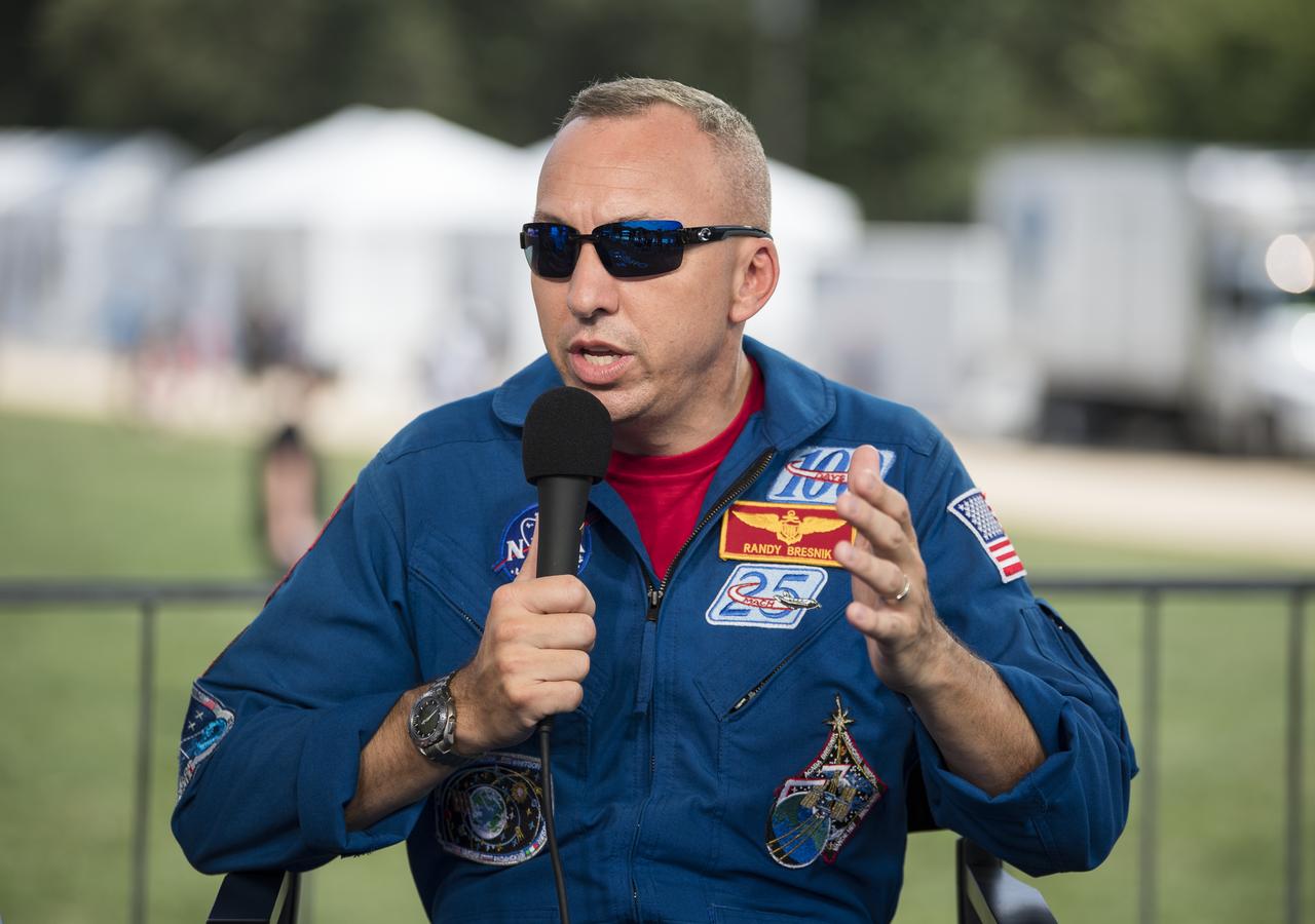 NASA astronaut Randy Bresnik speaks during “NASA’s Giant Leaps: Past and Future," a live television program on Friday, July 19, 2019 on the National Mall in Washington. NASA and the world are recognizing the 50th anniversary of Apollo 11, in which astronauts Neil Armstrong, Michael Collins, and Buzz Aldrin crewed the first mission to land astronauts on the Moon. Photo Credit: (NASA/Aubrey Gemignani)