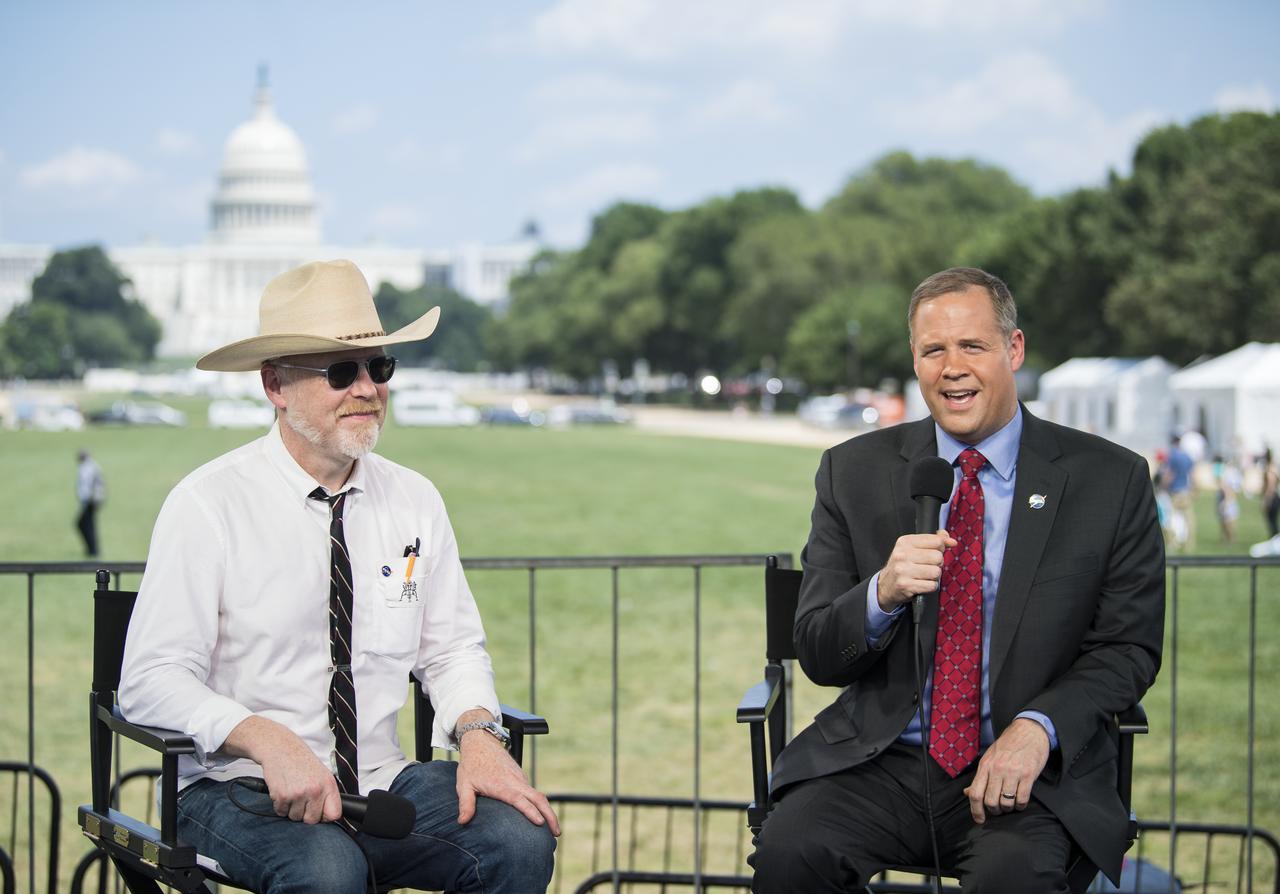 NASA Administrator Jim Bridenstine, right, speaks with Adam Savage, maker and host of Savage Builds, during “NASA’s Giant Leaps: Past and Future," a live television program on Friday, July 19, 2019 on the National Mall in Washington. NASA and the world are recognizing the 50th anniversary of Apollo 11, in which astronauts Neil Armstrong, Michael Collins, and Buzz Aldrin crewed the first mission to land astronauts on the Moon. Photo Credit: (NASA/Aubrey Gemignani)