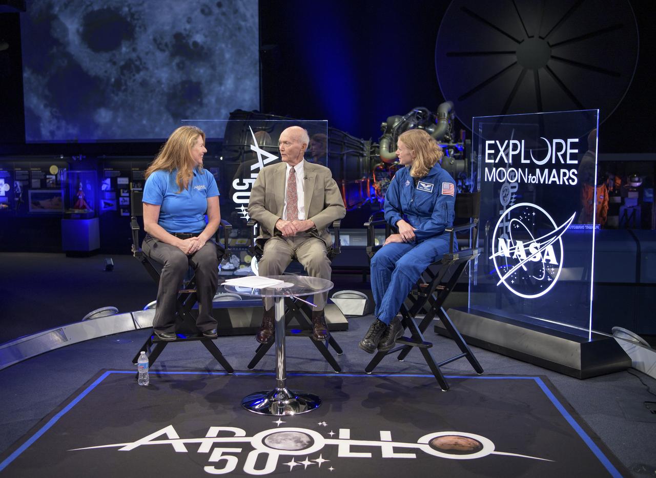 NASA Public Affairs Officer for Heliophysics Karen Fox, left, interviews, Apollo 11 astronaut Mike Collins, and NASA astronaut candidate Zena Cardman during “NASA’s Giant Leaps: Past and Future," a live television program on Friday, July 19, 2019 from the Smithsonian National Air and Space Museum in Washington. NASA and the world are recognizing the 50th anniversary of Apollo 11, in which astronauts Neil Armstrong, Michael Collins, and Buzz Aldrin crewed the first mission to land astronauts on the Moon. Photo Credit: (NASA/Bill Ingalls)