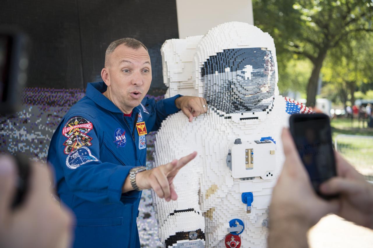 NASA astronaut Randy Bresnik speaks at the LEGO exhibit for a video at the Apollo 11 50th Anniversary celebration on the National Mall, Friday, July 19, 2019 in Washington. Apollo 11 was the first mission to land astronauts on the Moon and launched on July 16, 1969 with astronauts Neil Armstrong, Michael Collins, and Buzz Aldrin. Photo Credit: (NASA/Aubrey Gemignani)