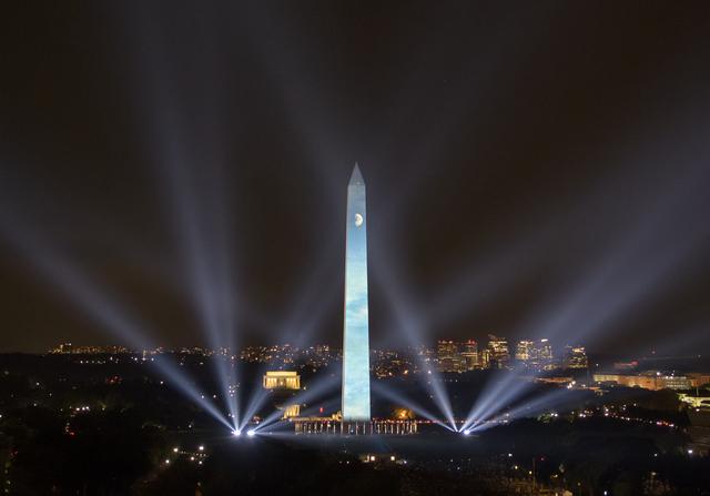 NASA image: Apollo 11 Saturn V Rocket Projected On The Washington Monument