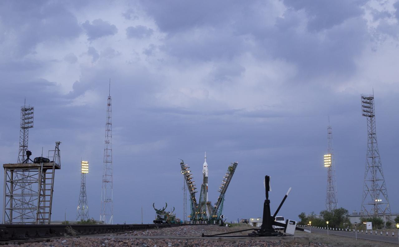 The Soyuz rocket with MS-13 spacecraft onboard is seen on the launch pad as the service structure arms are lowered before launch, Saturday, July 20, 2019 at the Baikonur Cosmodrome in Kazakhstan. Expedition 60 Soyuz Commander Alexander Skvortsov of Roscosmos, flight engineer Andrew Morgan of NASA, and flight engineer Luca Parmitano of ESA (European Space Agency) launched at 12:28 p.m. Eastern time (9:28 p.m. Baikonur time) to begin their mission to the International Space Station. Photo Credit: (NASA/Joel Kowsky)