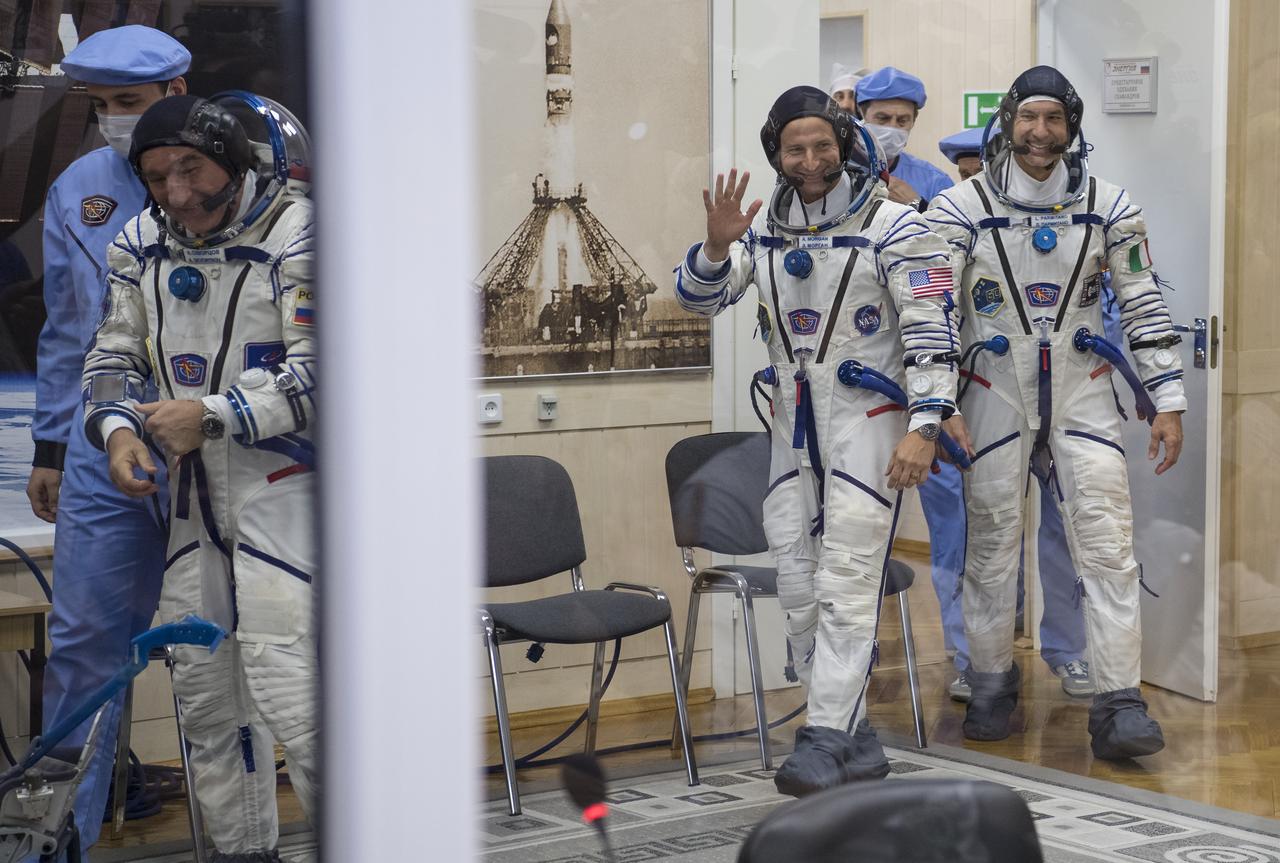 Expedition 60 Soyuz Commander Alexander Skvortsov of Roscosmos, left, flight engineer Andrew Morgan of NASA, center, and flight engineer Luca Parmitano of ESA (European Space Agency), right, are seen after donning their Russian Sokol suits in preparation for launch aboard the Soyuz MS-13 spacecraft, Saturday, July 20, 2019 at the Baikonur Cosmodrome in Kazakhstan. Skvortsov, Morgan, and Parmitano launched aboard the Soyuz MS-13 spacecraft at 12:28 p.m. Eastern time (9:28 p.m. Baikonur time) on July 20 to begin their journey to the International Space Station. Photo Credit: (NASA/Joel Kowsky)
